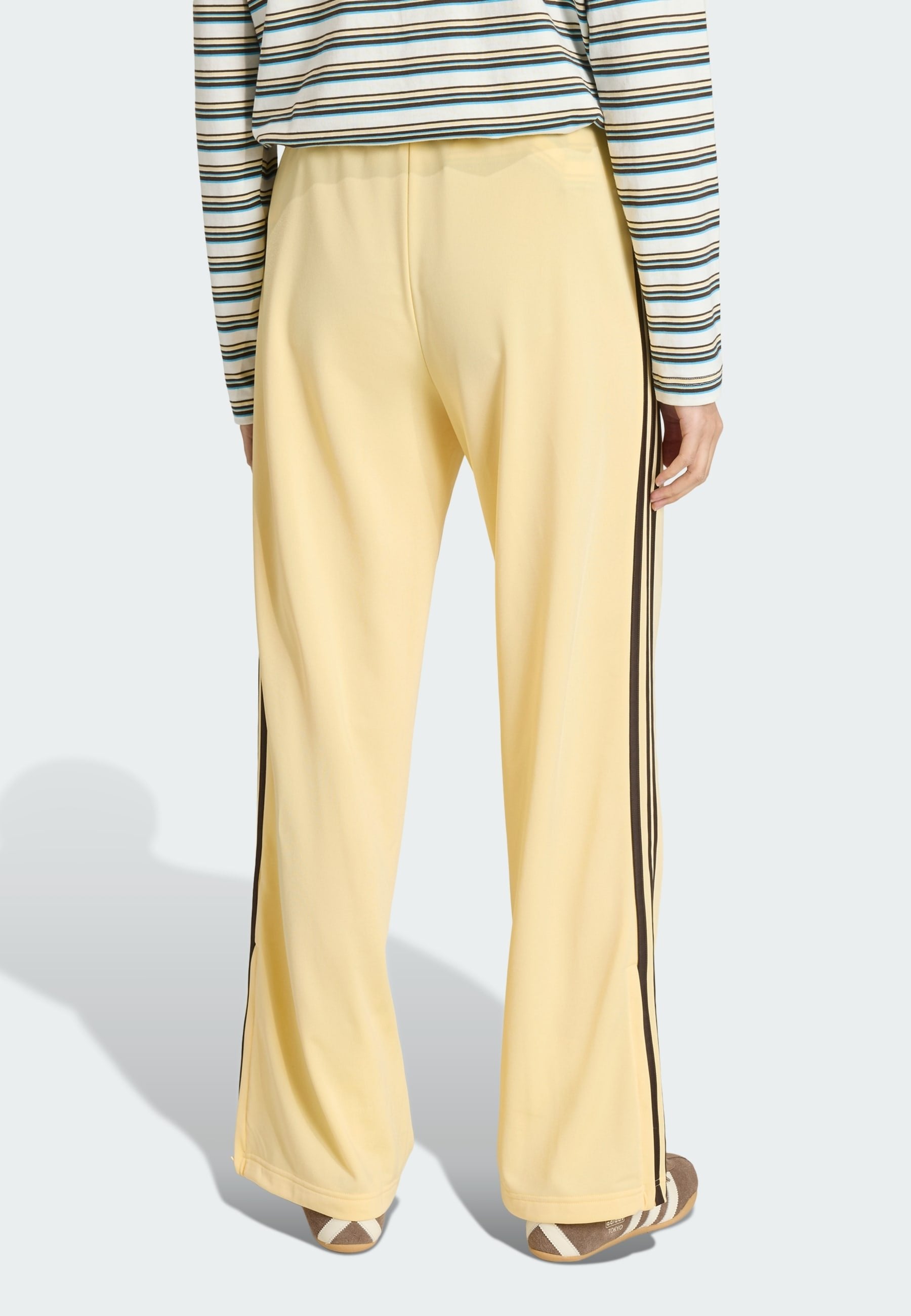 LOOSE - Tracksuit bottoms - orange tint