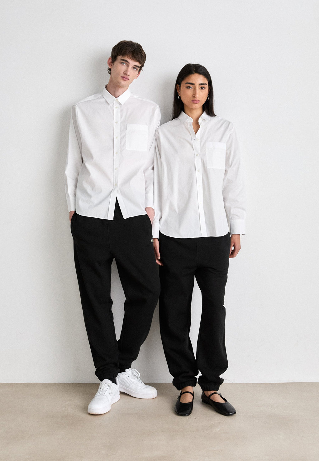 UNISEX - Tracksuit bottoms - black