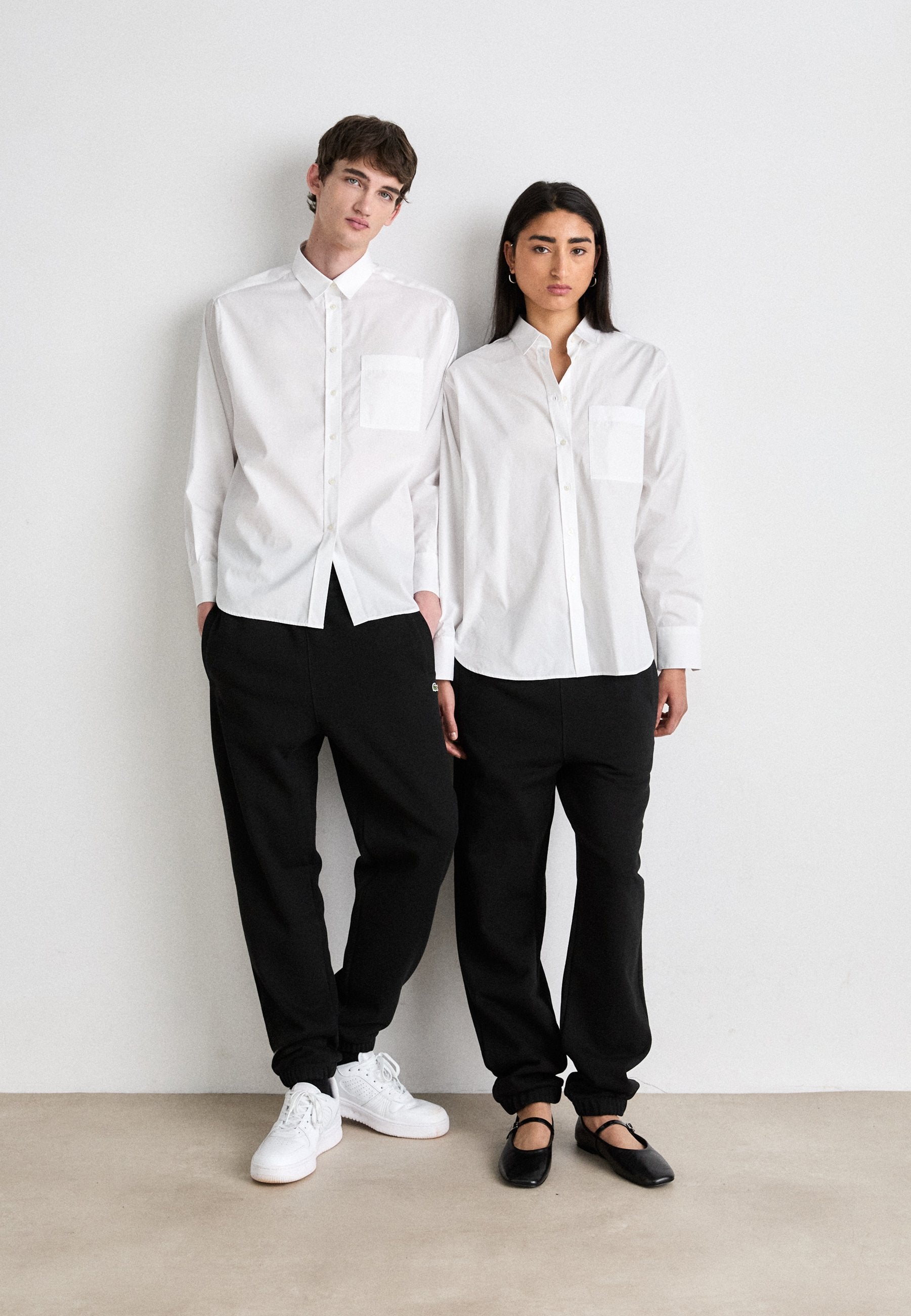 UNISEX - Tracksuit bottoms - black