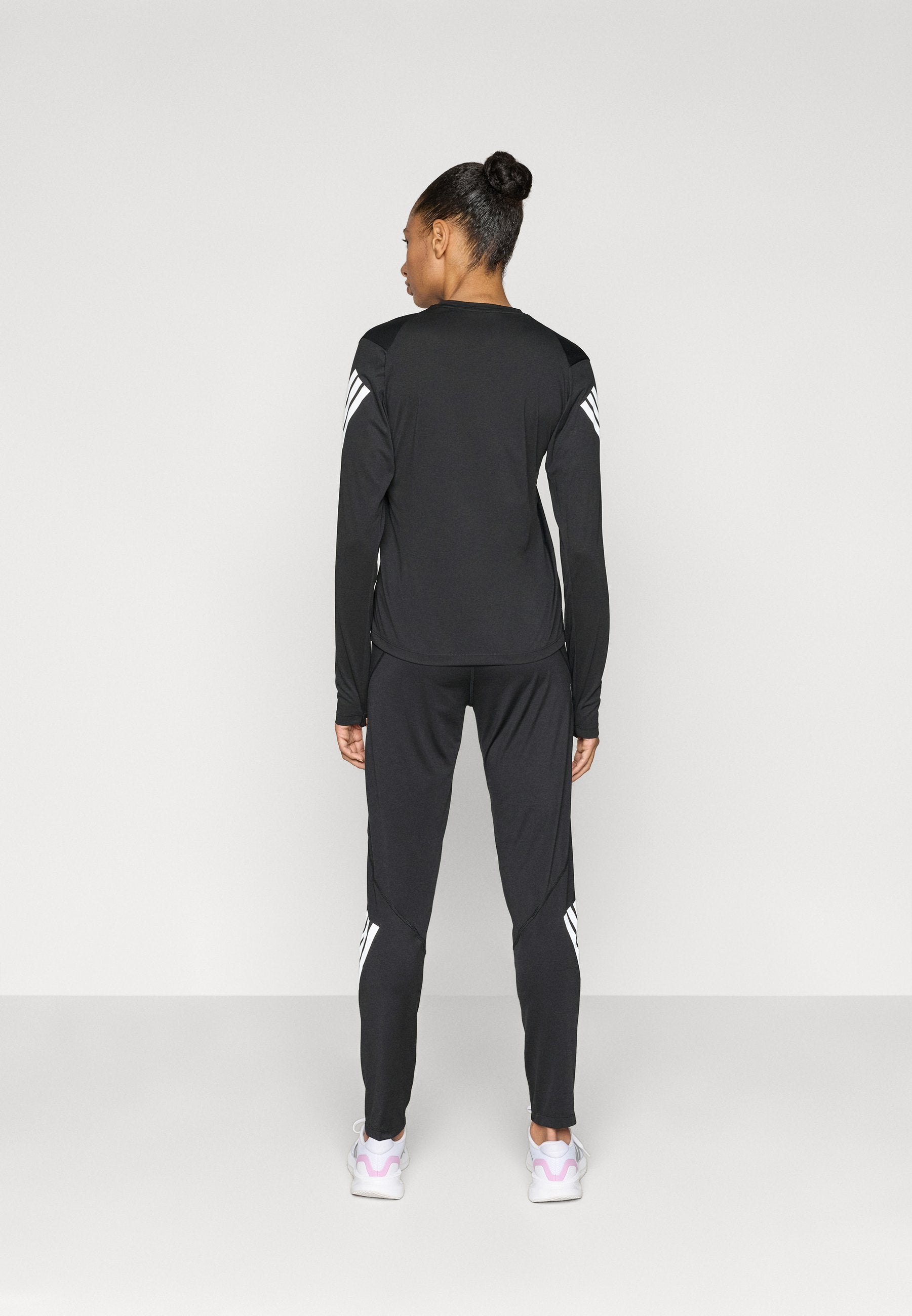 ADI365 - Tracksuit bottoms - black