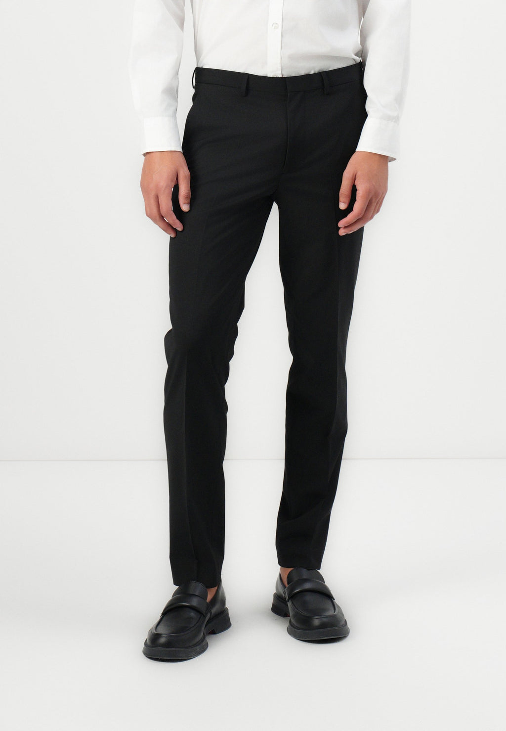 HESTEN - Trousers - black
