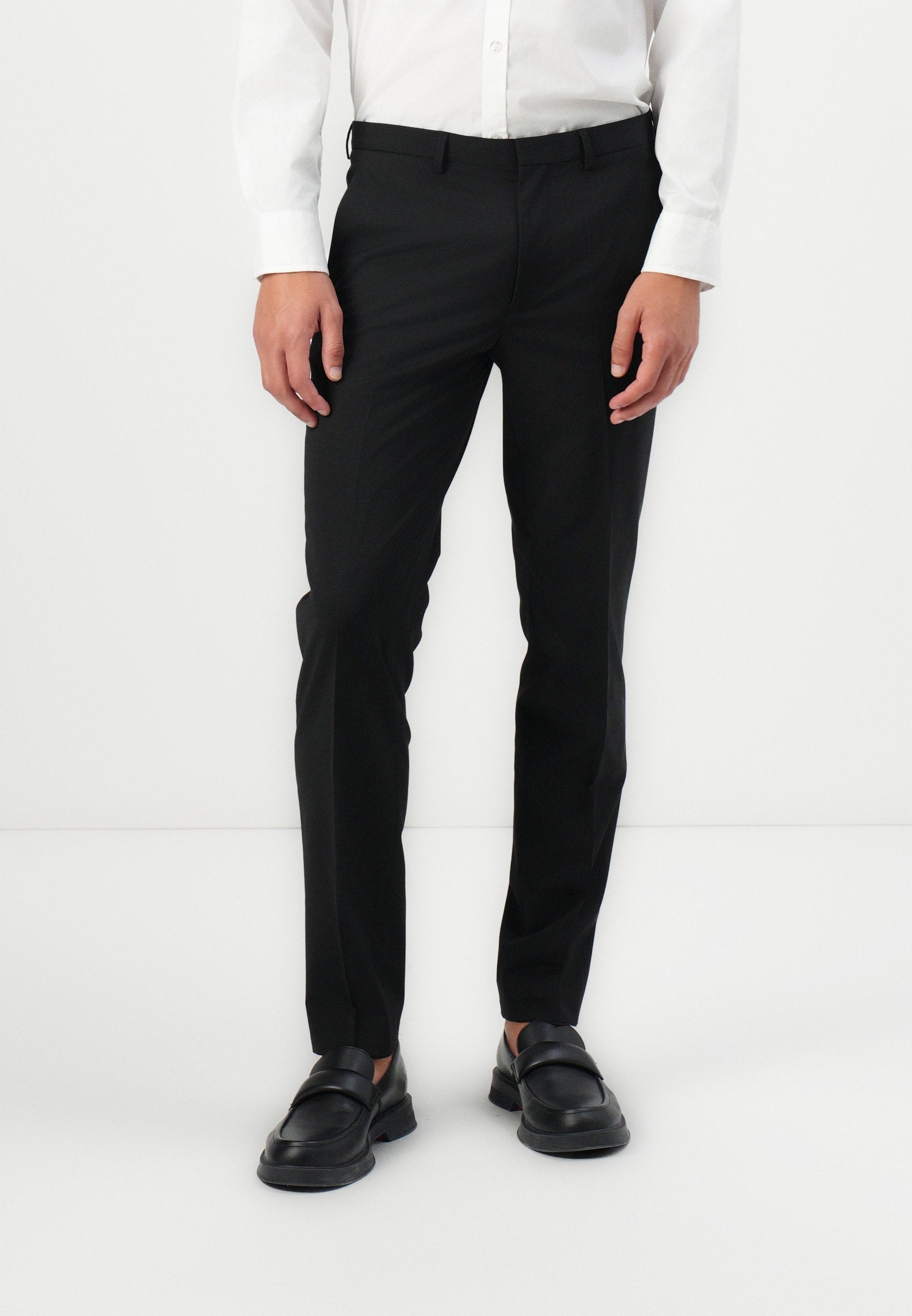 HESTEN - Trousers - black