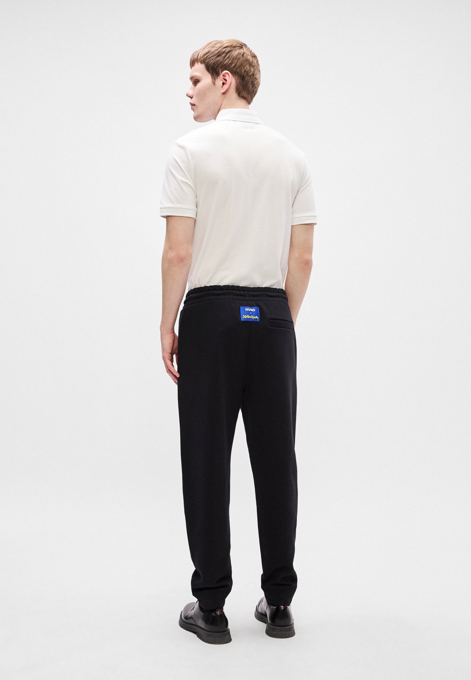 X JUJUTSU KAISEN NIMAYTRO - Tracksuit bottoms - black