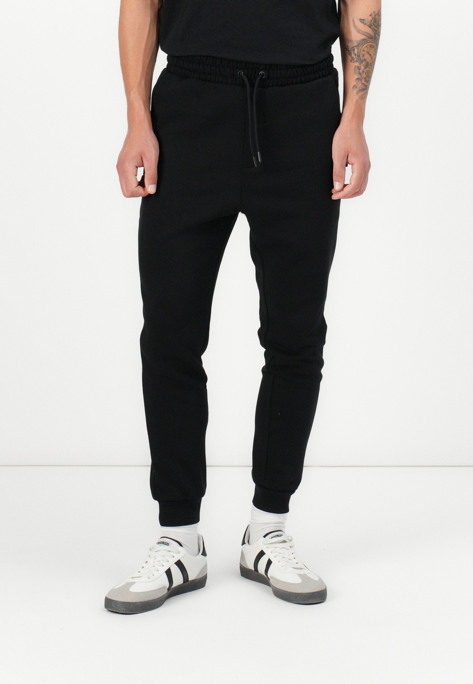Regular Fit - Tracksuit bottoms - black