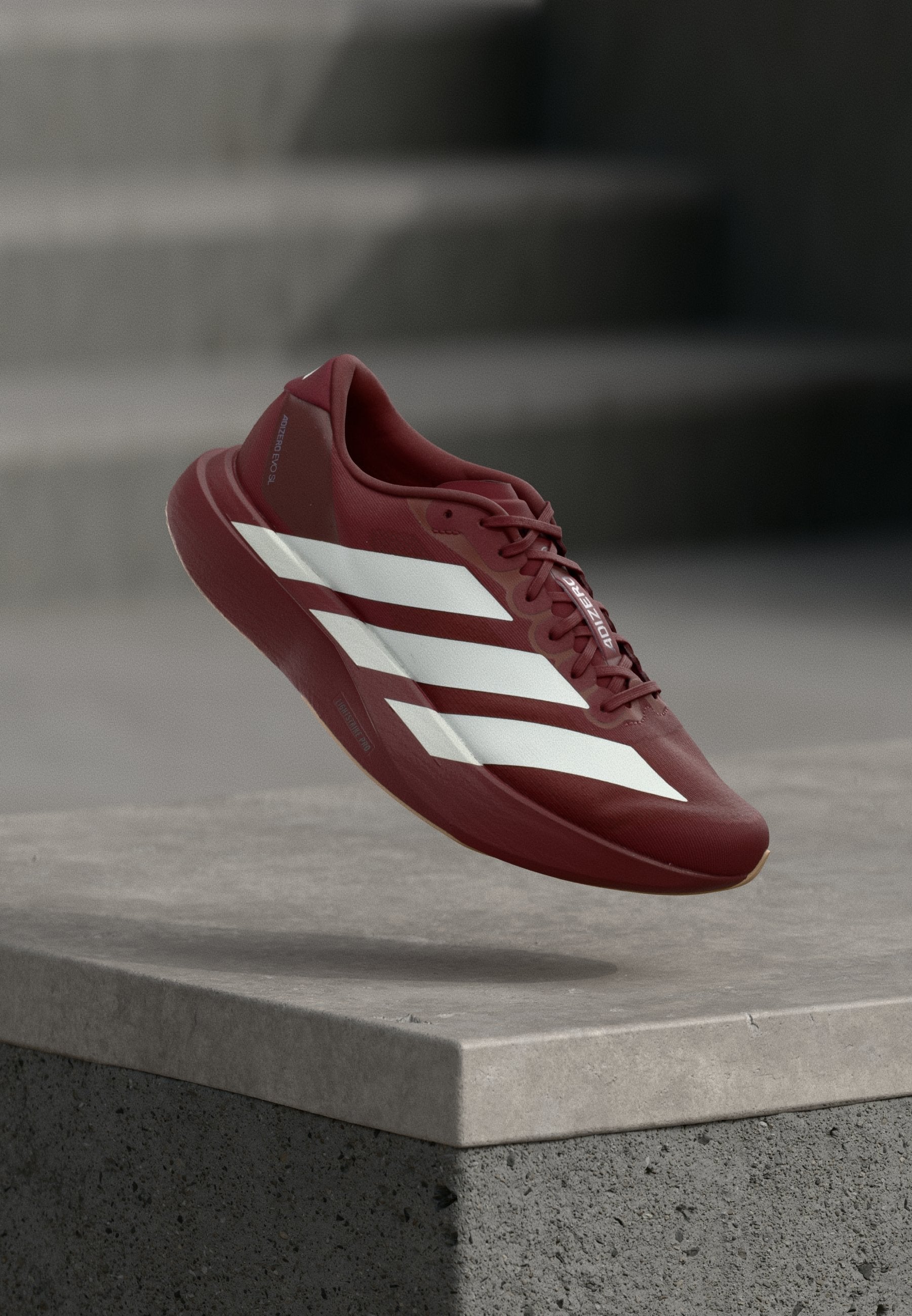 ADIZERO EVO SL M - أحذية رياضية - أحمر ظل/أبيض غير مصقول/فضي معدني