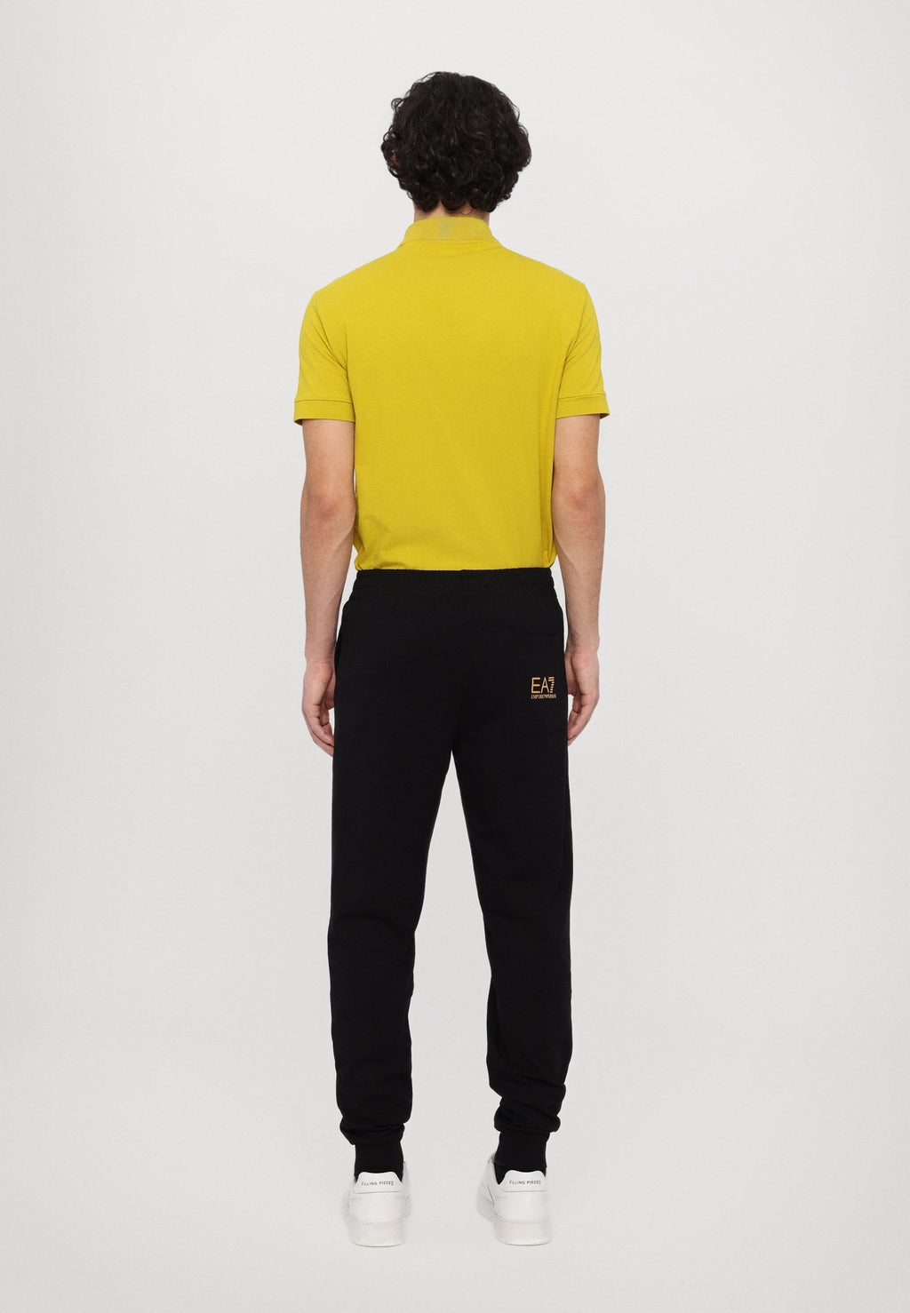 TRAIN LOGO SERIES PANTS  - Tracksuit bottoms - black/gold