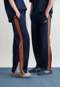 FIREBIRD TP - Tracksuit bottoms - night indigo/lucid orange