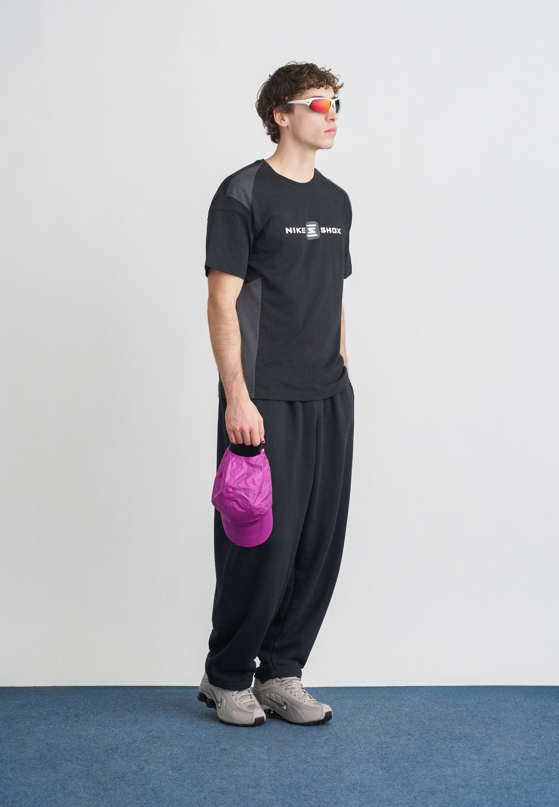CLUB - Tracksuit bottoms - black/white