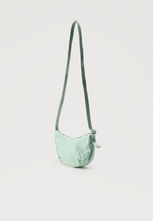 AURA CRESCENT CROSSBODY UNISEX - Cross body bag - mint/gold-coloured