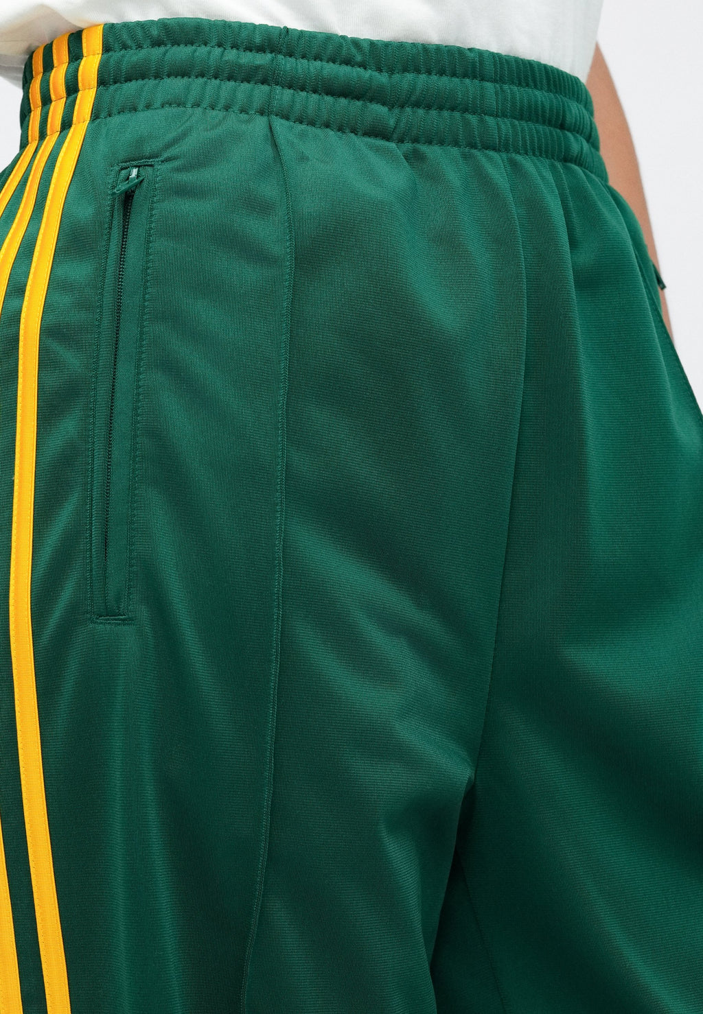 FIREBIRD LOOSE TRACKSUIT PANTS - Tracksuit bottoms - collegiate green/crew yellow