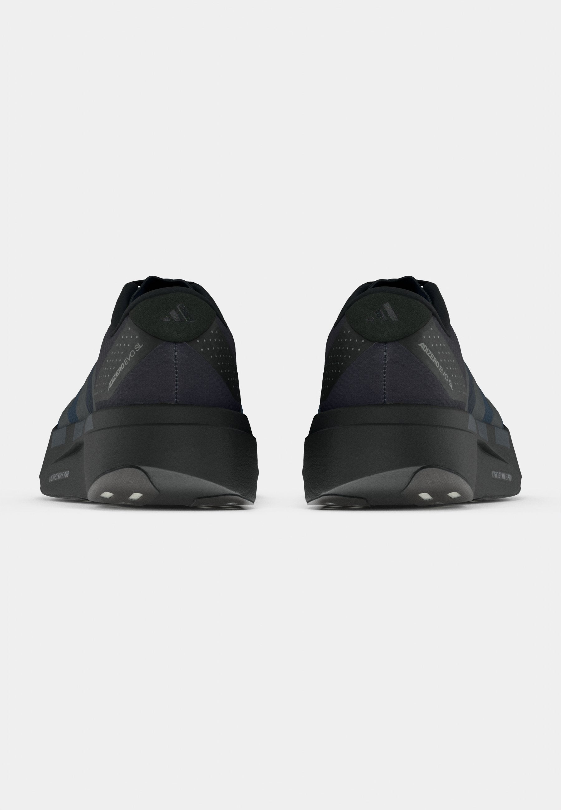 ADIZERO EVO SL WOVEN M - Trainers - black/dark blue