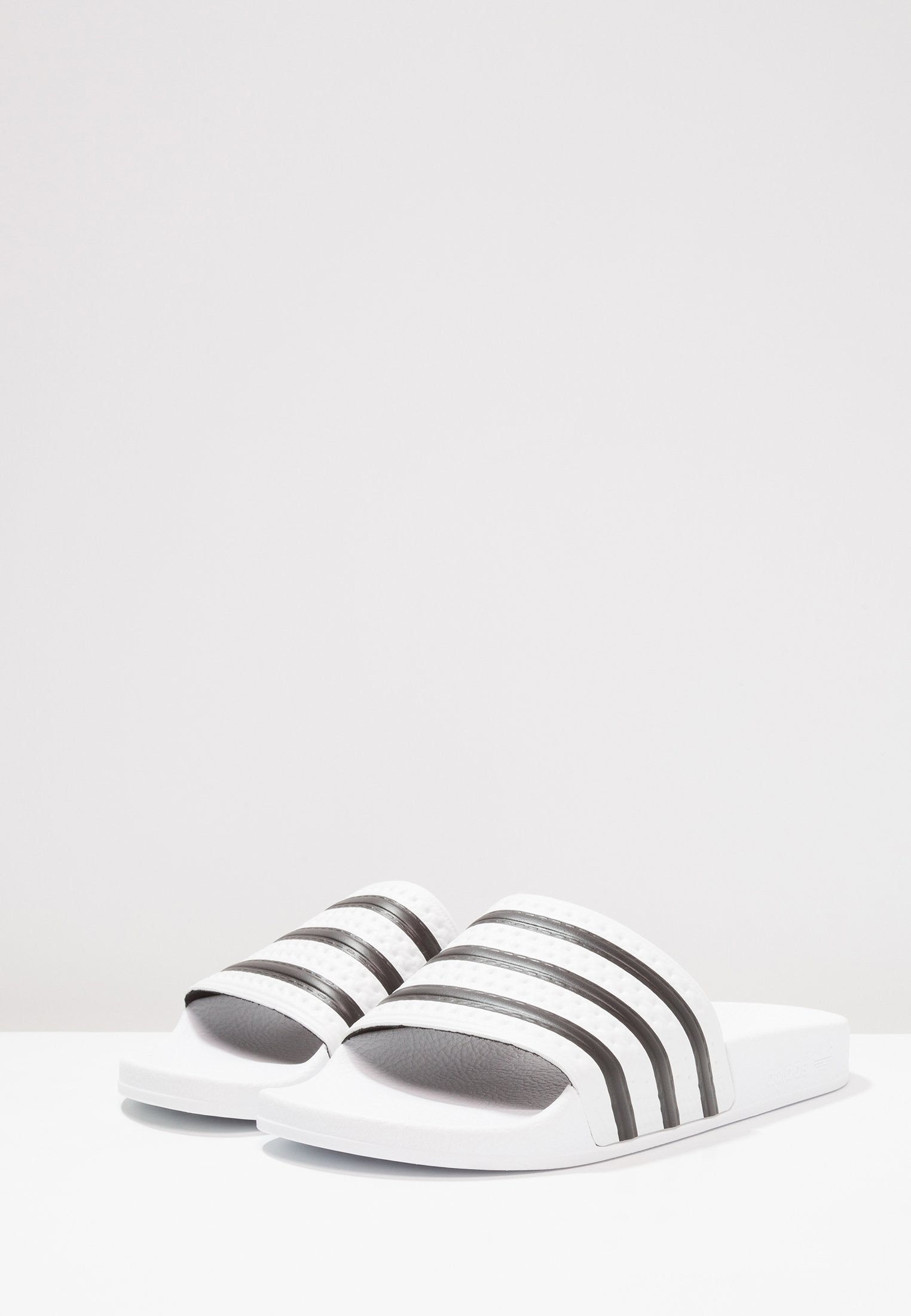 ADILETTE - Pool slides - white/black