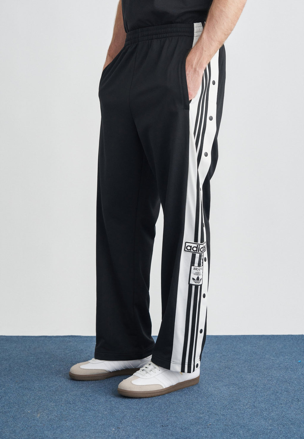 ADIBREAK UNISEX - Tracksuit bottoms - black/white