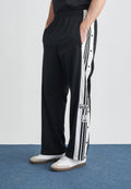ADIBREAK UNISEX - Tracksuit bottoms - black/white