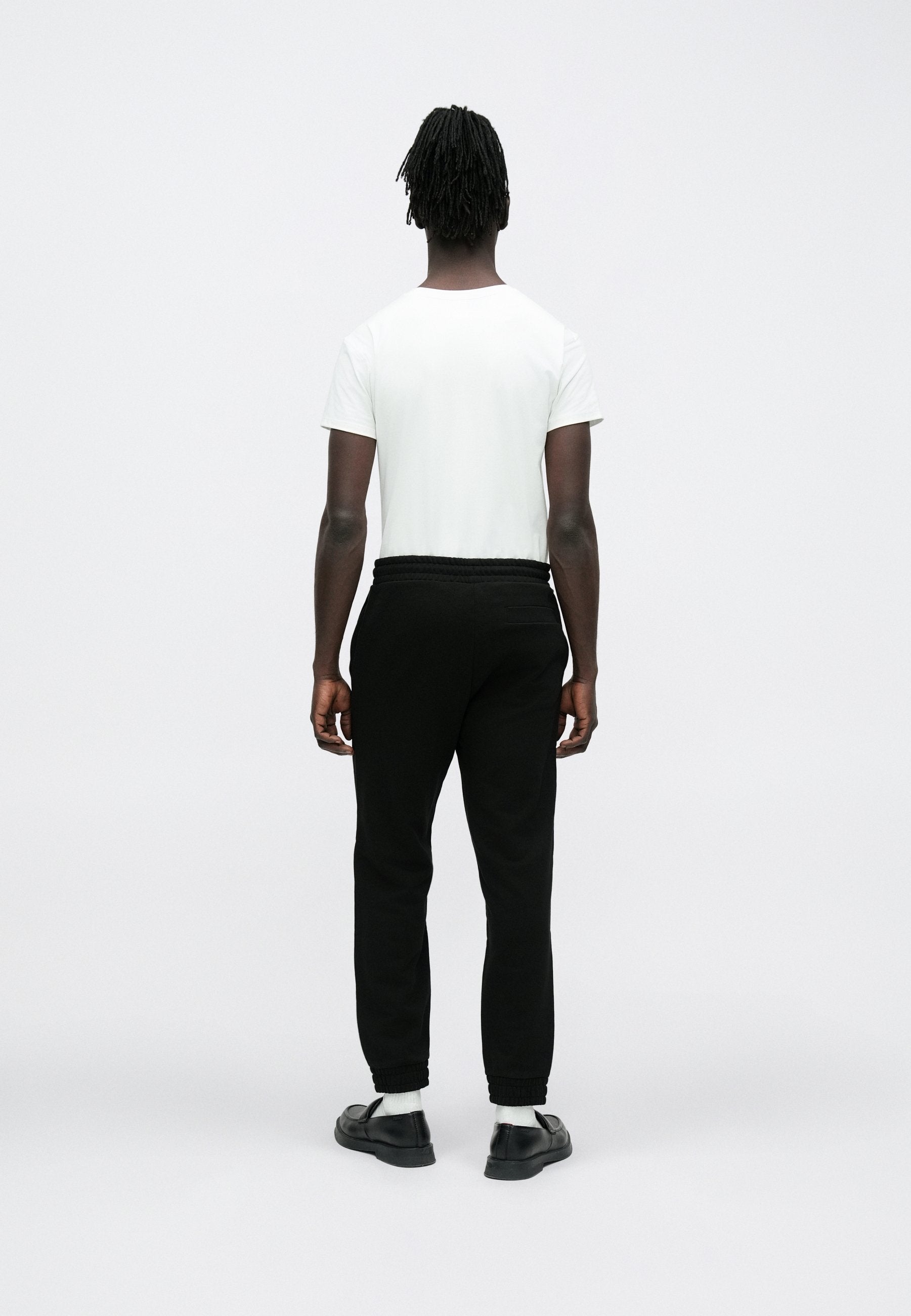 DANOPAN - Tracksuit bottoms - black