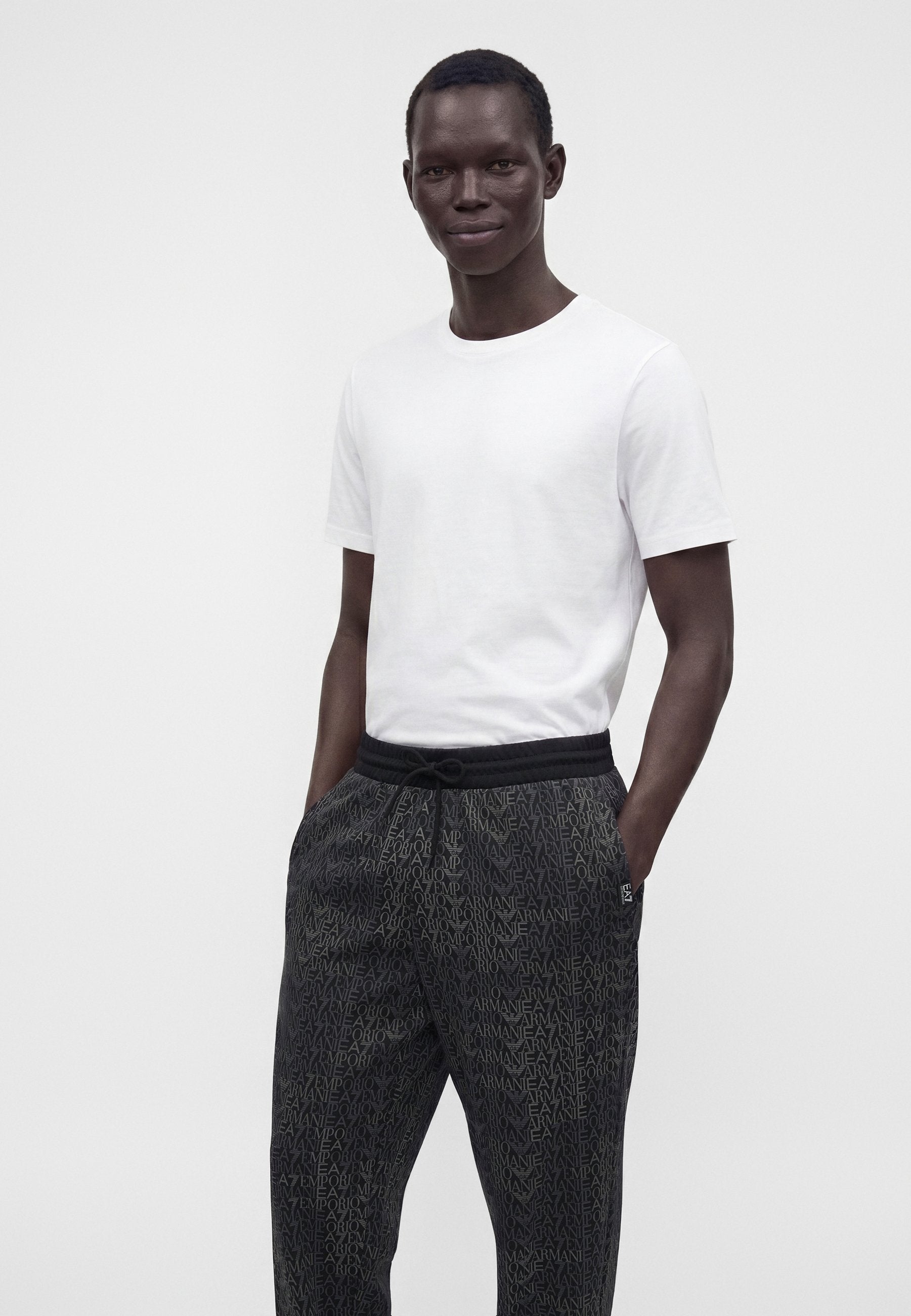 TRAIN LOGO SERIES MONOGRAM - Tracksuit bottoms - black