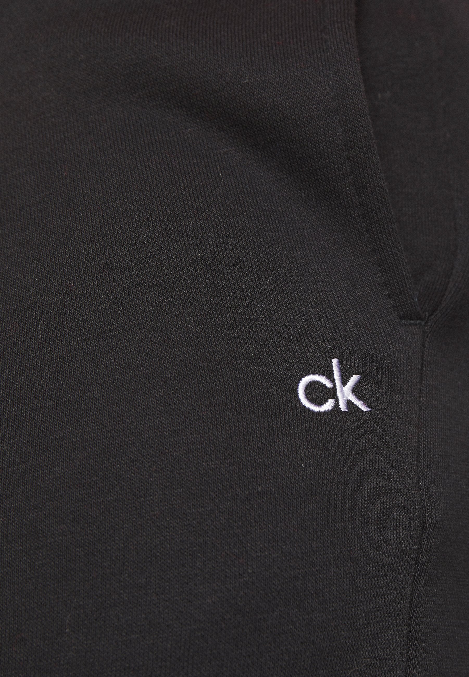 PLANET JOGGER - Tracksuit bottoms - black