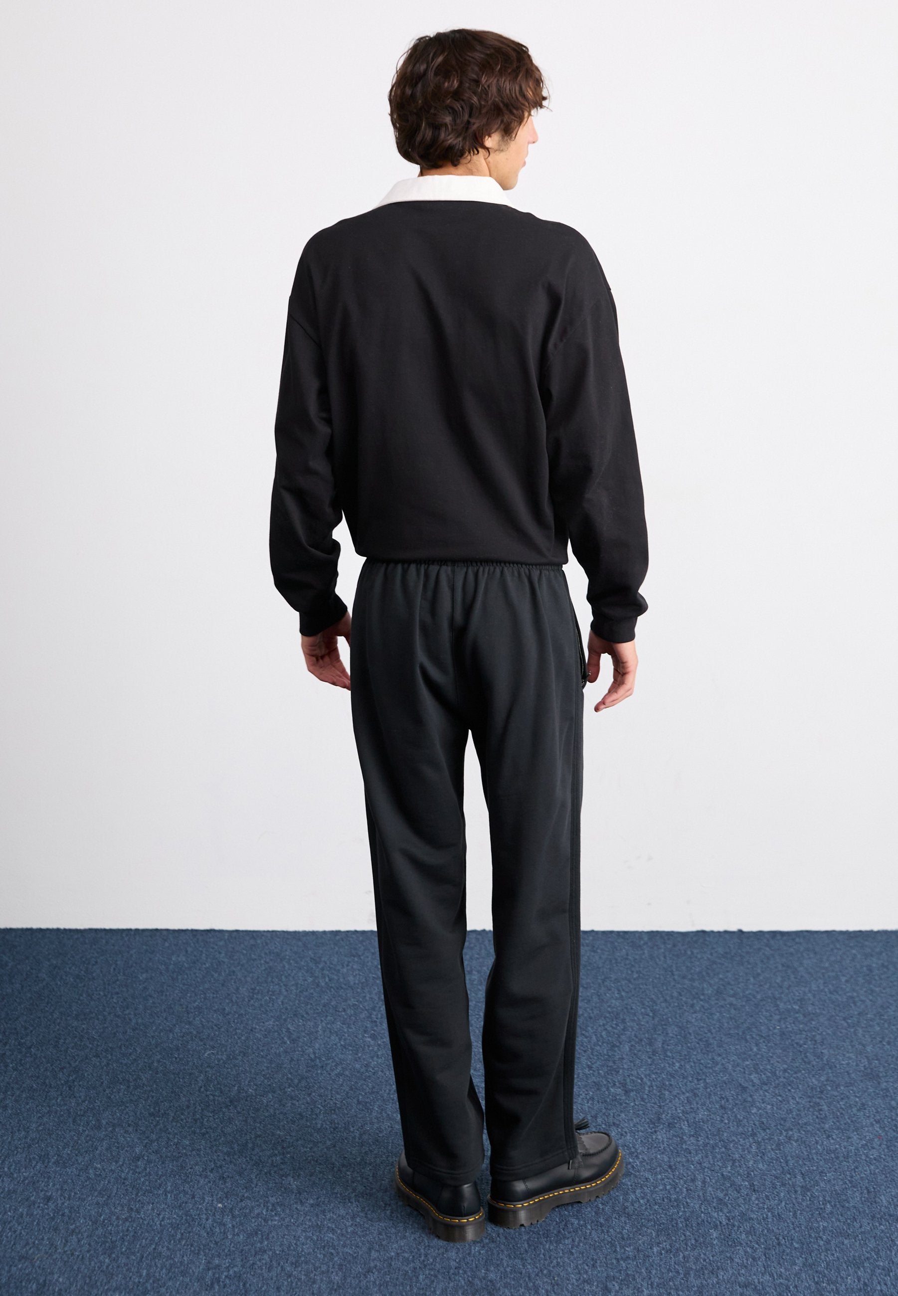 WIDE - Tracksuit bottoms - black
