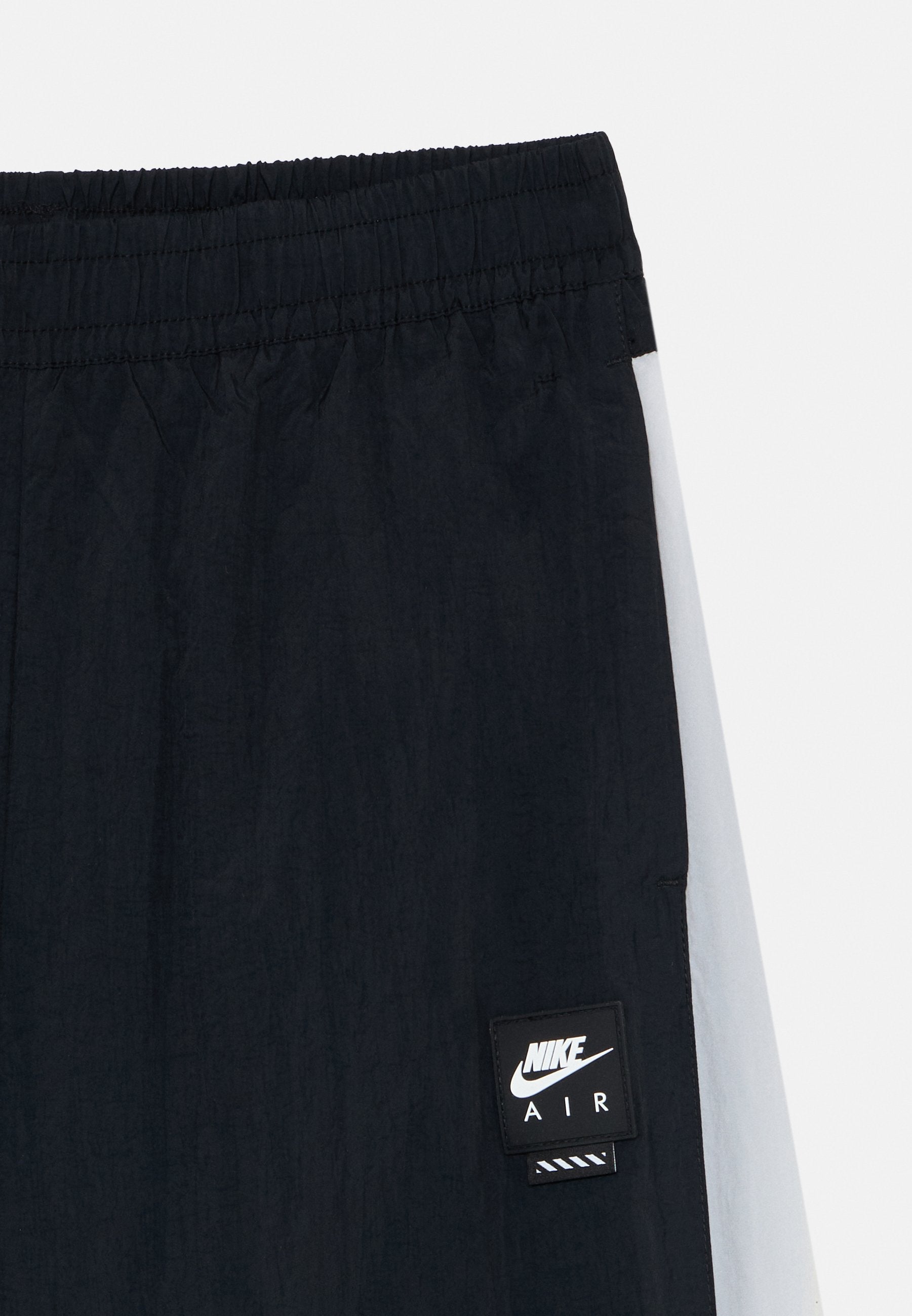 AIR TRACK UNISEX - Tracksuit bottoms - black/white