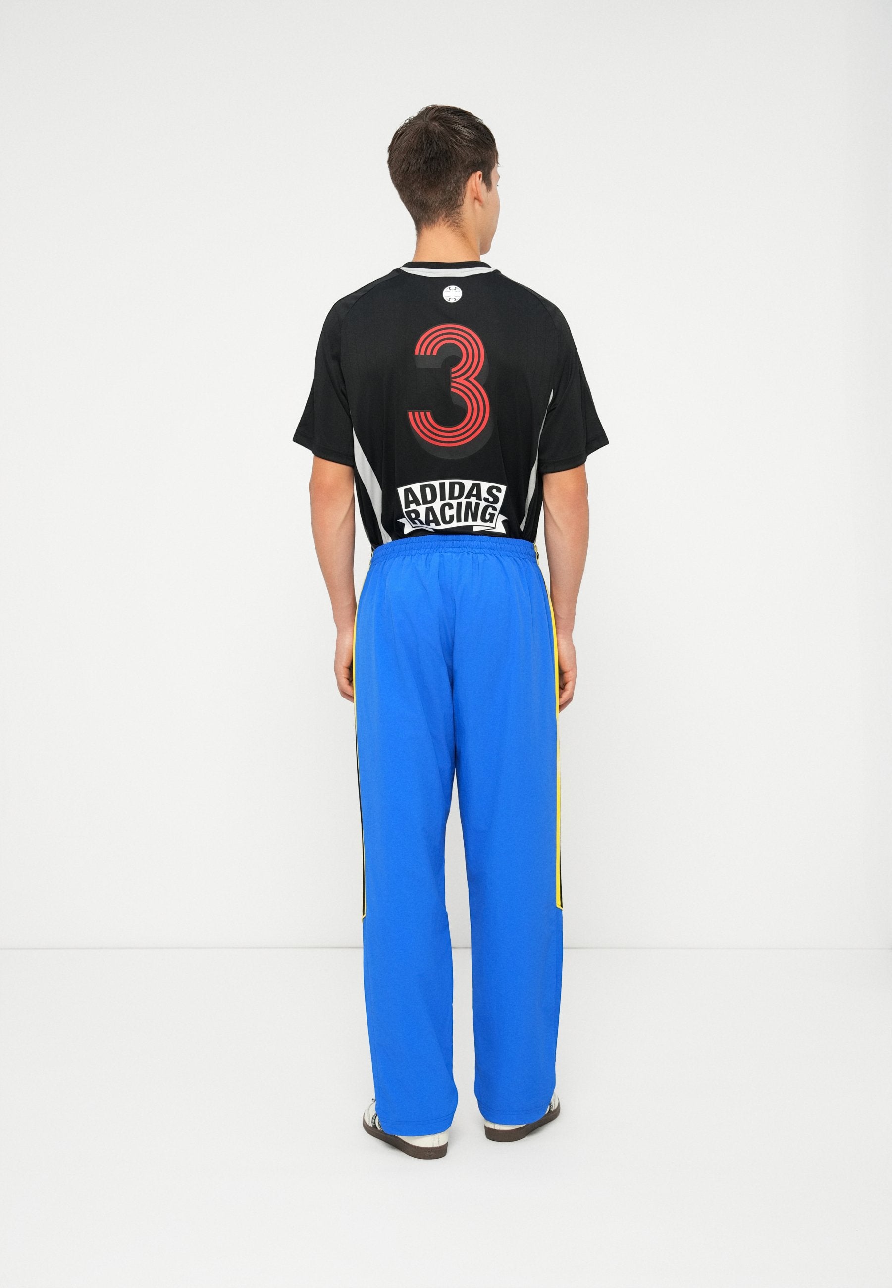GFX TRACK PANT UNISEX - Tracksuit bottoms - blue/black/white