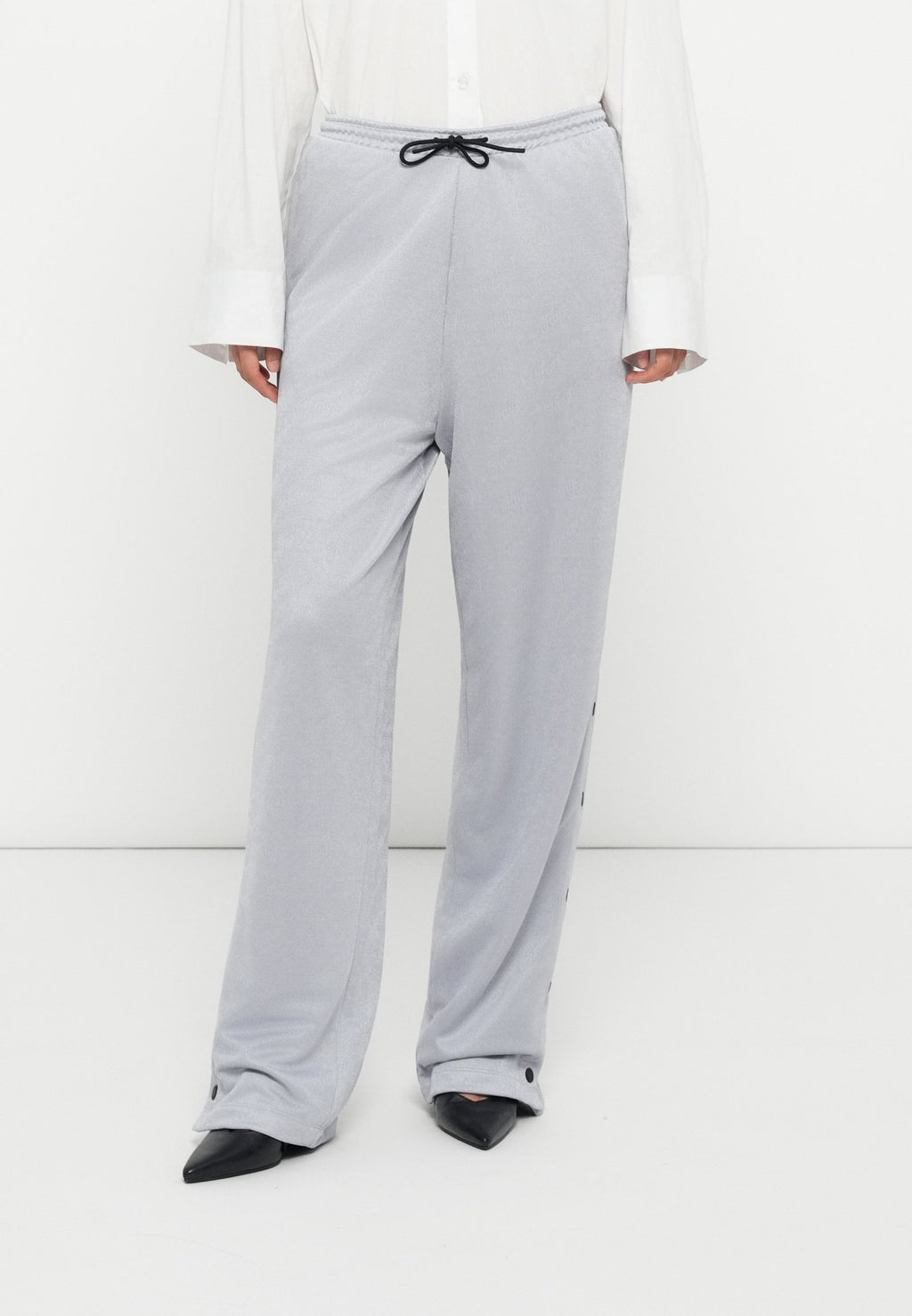 NICOLE - Tracksuit bottoms - silver-coloured
