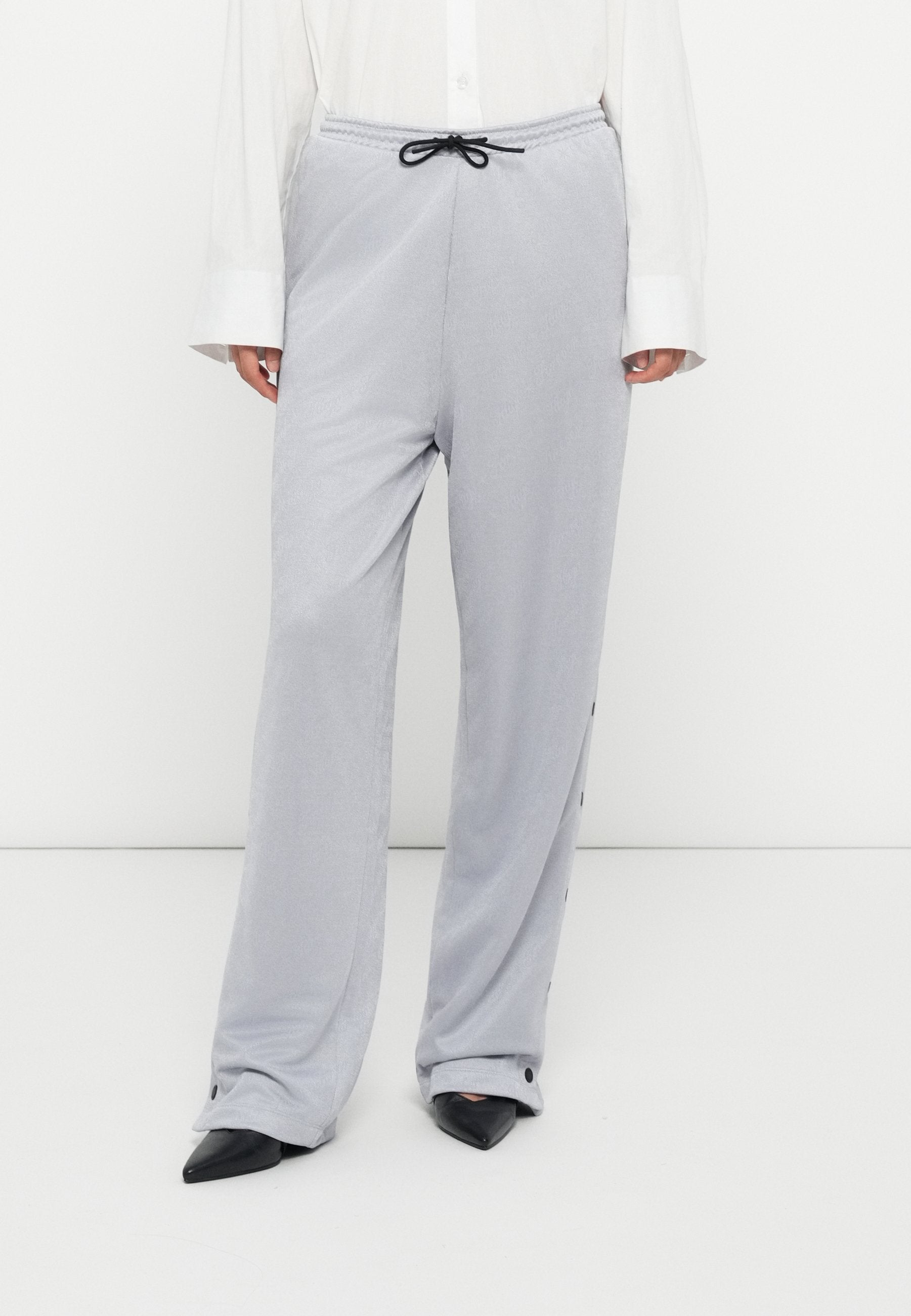 NICOLE - Tracksuit bottoms - silver-coloured