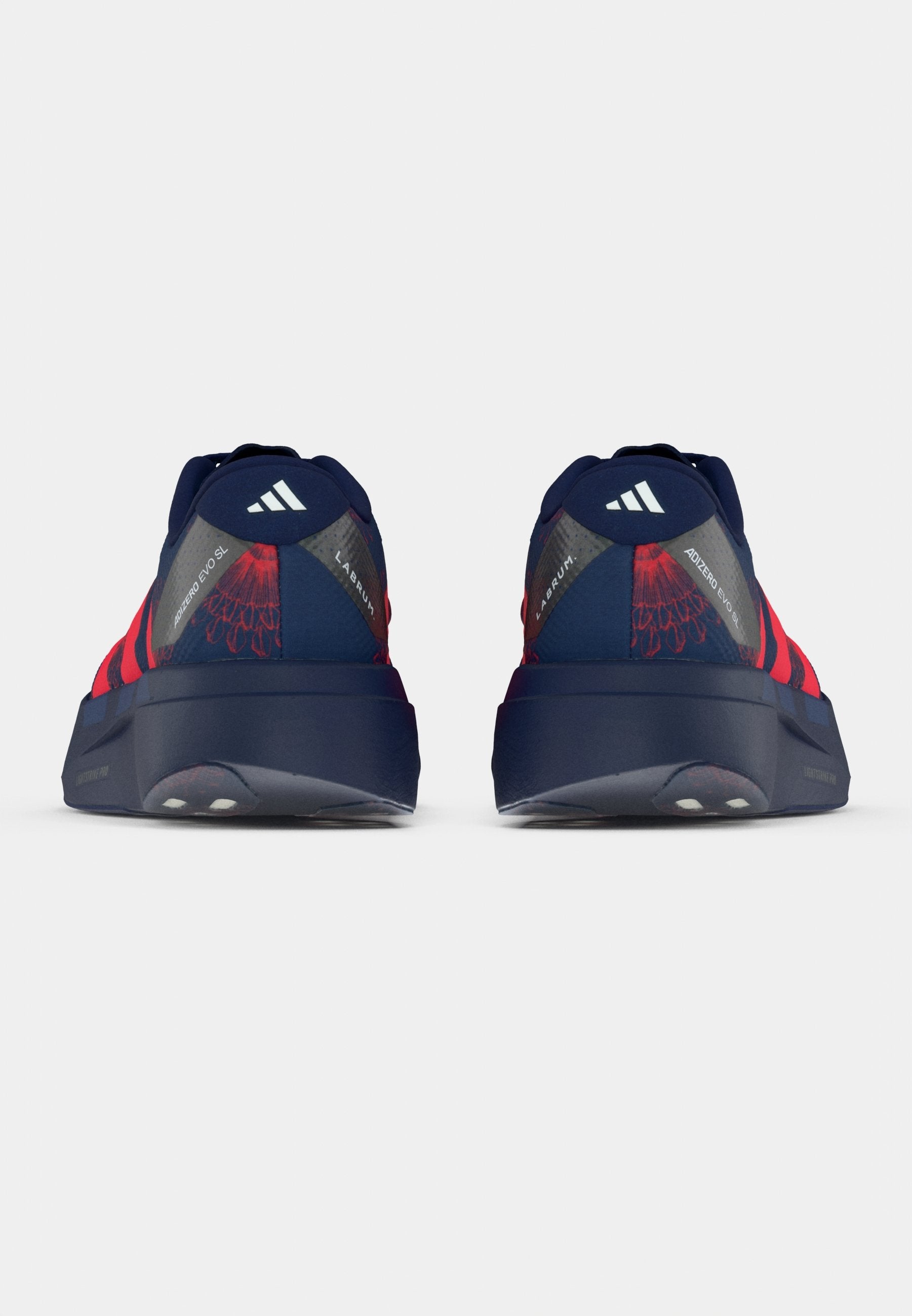 ADIZERO EVO SL - Trainers - dark blue/lucid red/muted purple
