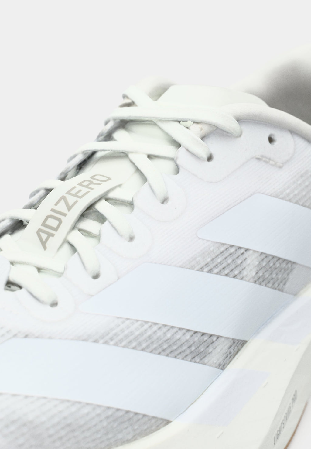 ADIZERO EVO SL W - Trainers - footwear white/warm sandstone