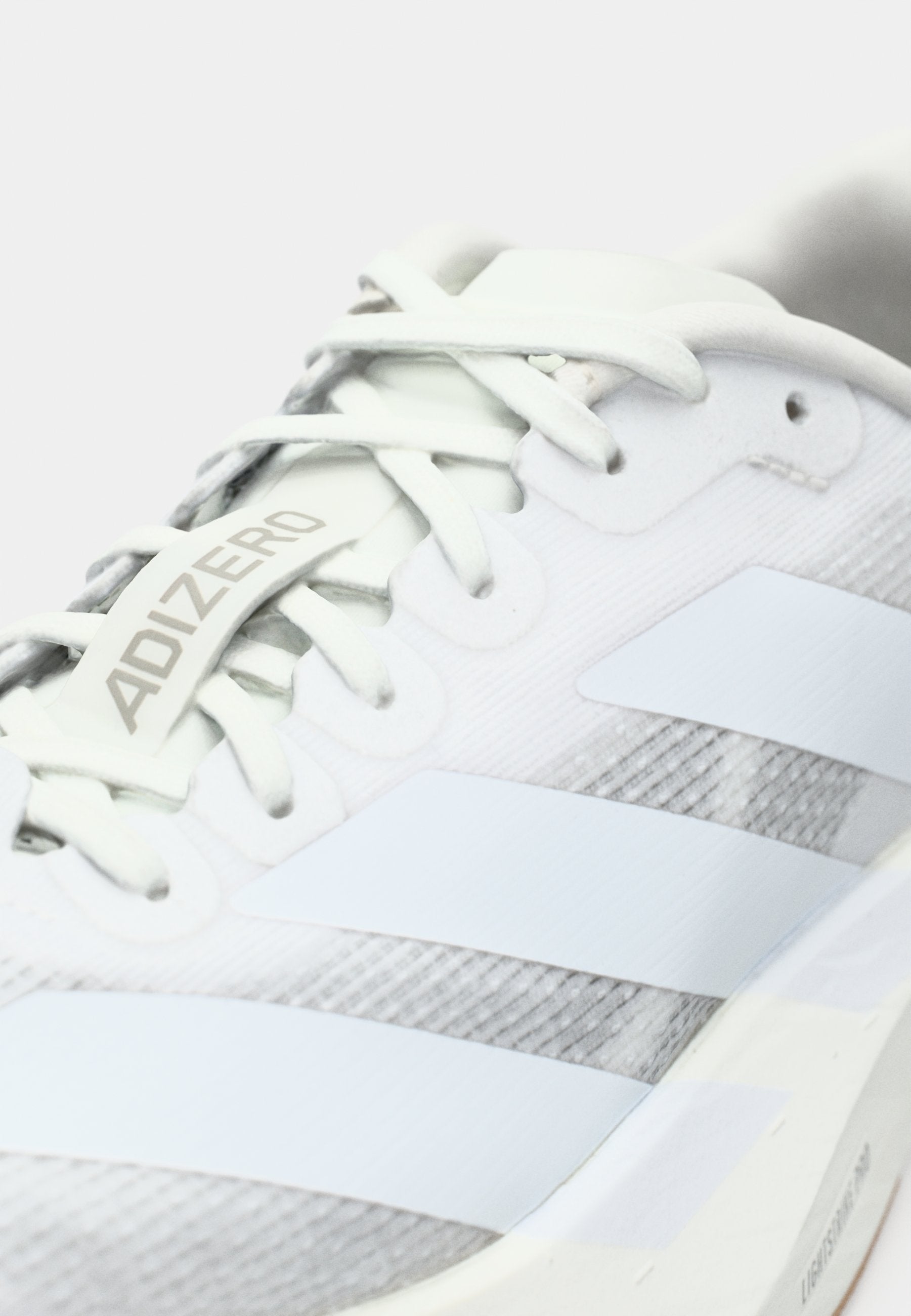 ADIZERO EVO SL W - Trainers - footwear white/warm sandstone