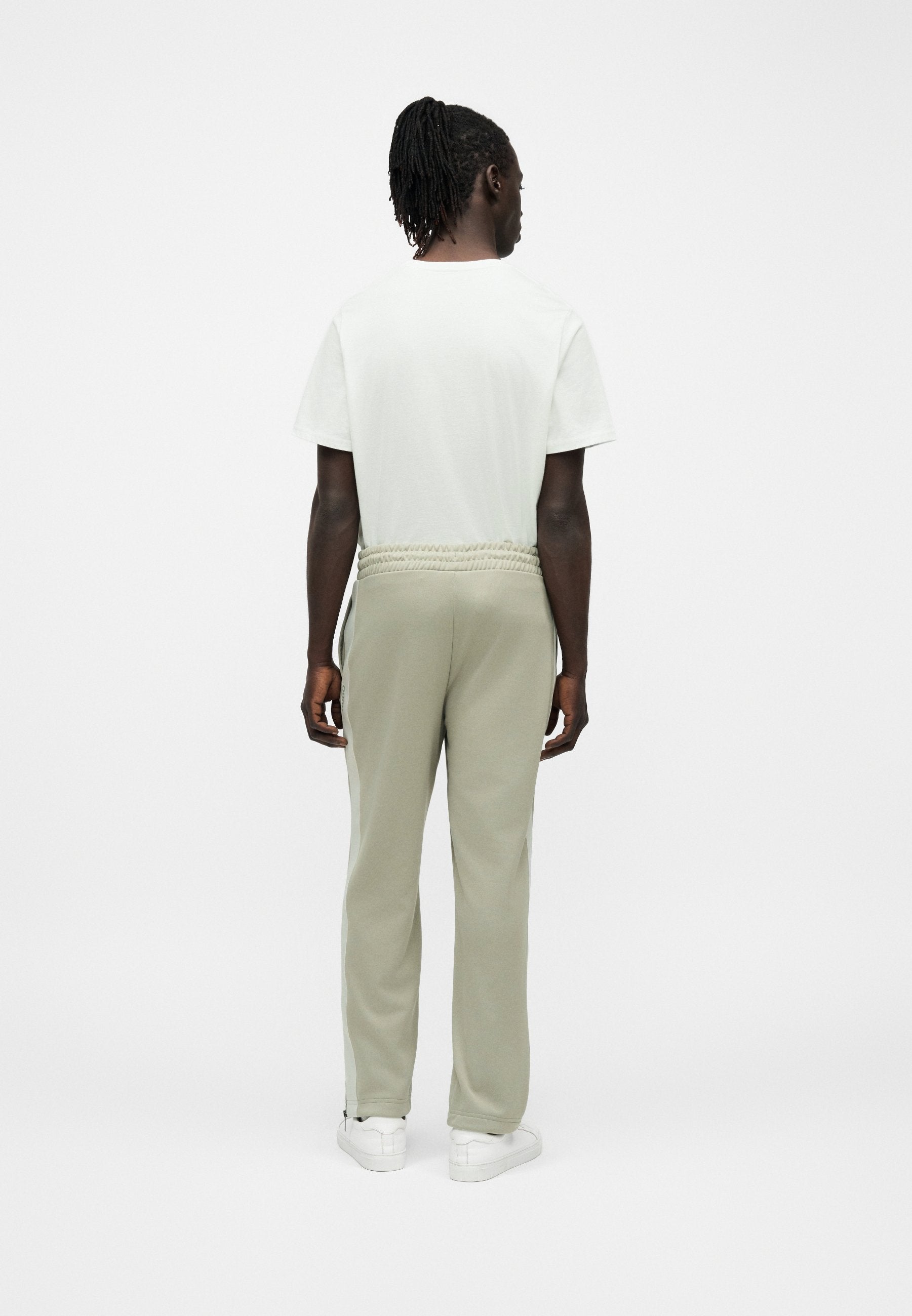DOLOS - Tracksuit bottoms - pastel green