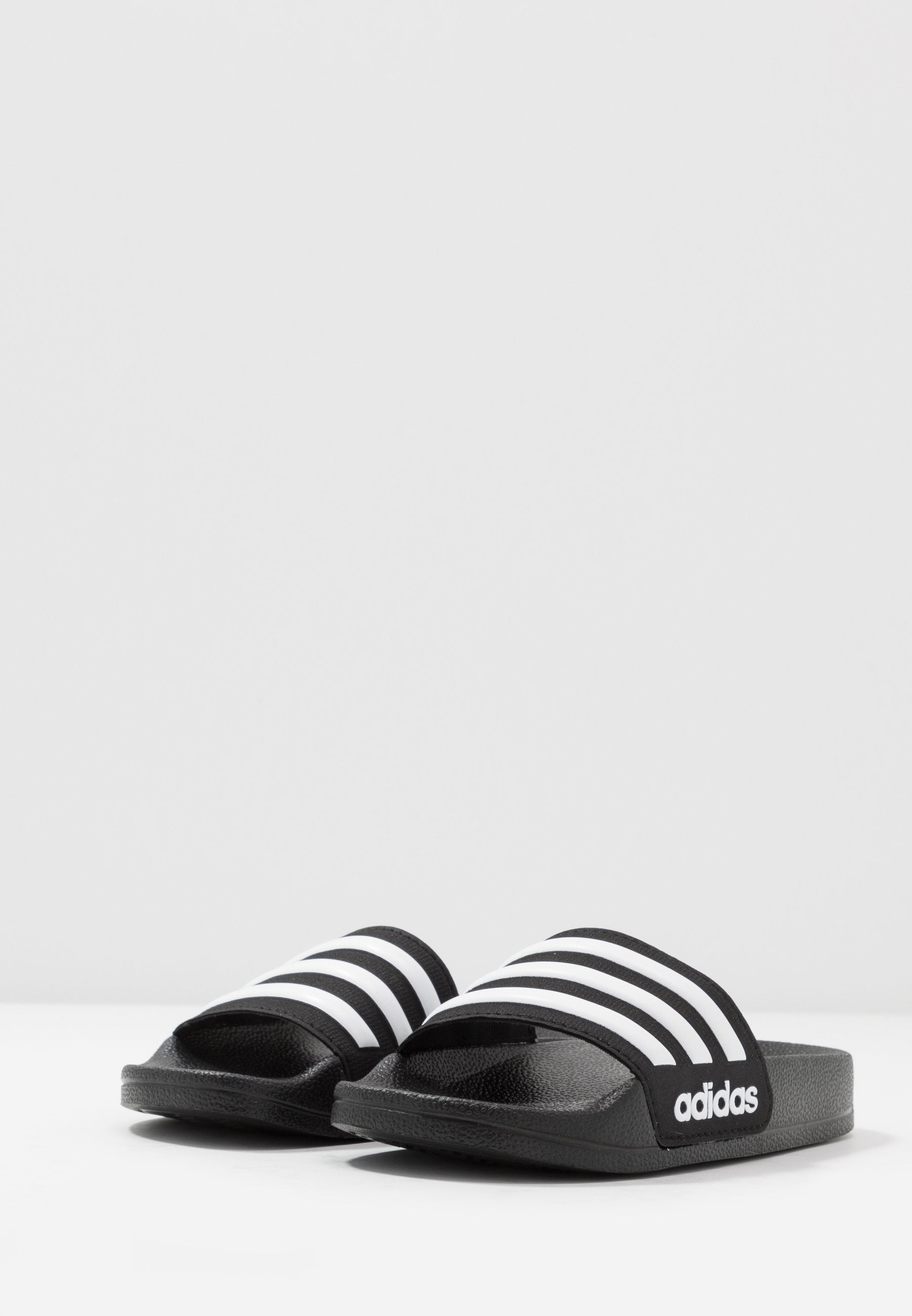ADILETTE SHOWER UNISEX - Pool slides - core black/footwear white