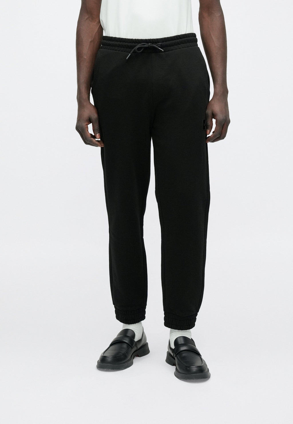 DANOPAN - Tracksuit bottoms - black
