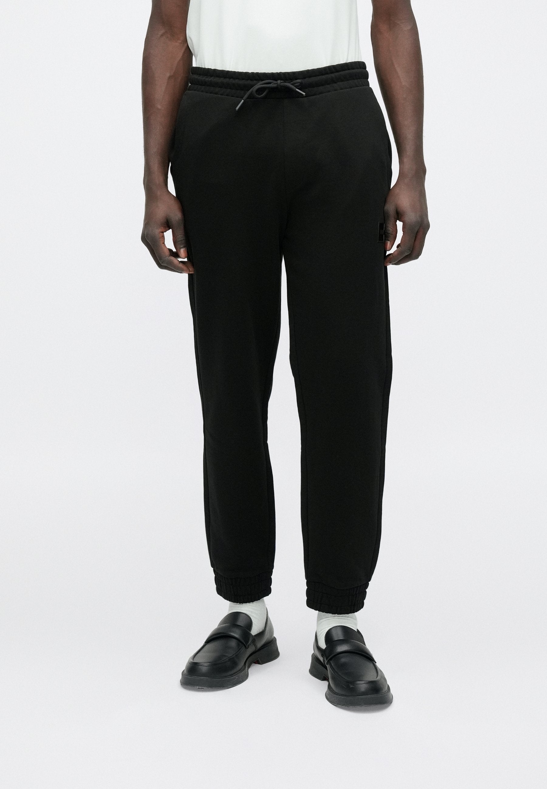 DANOPAN - Tracksuit bottoms - black