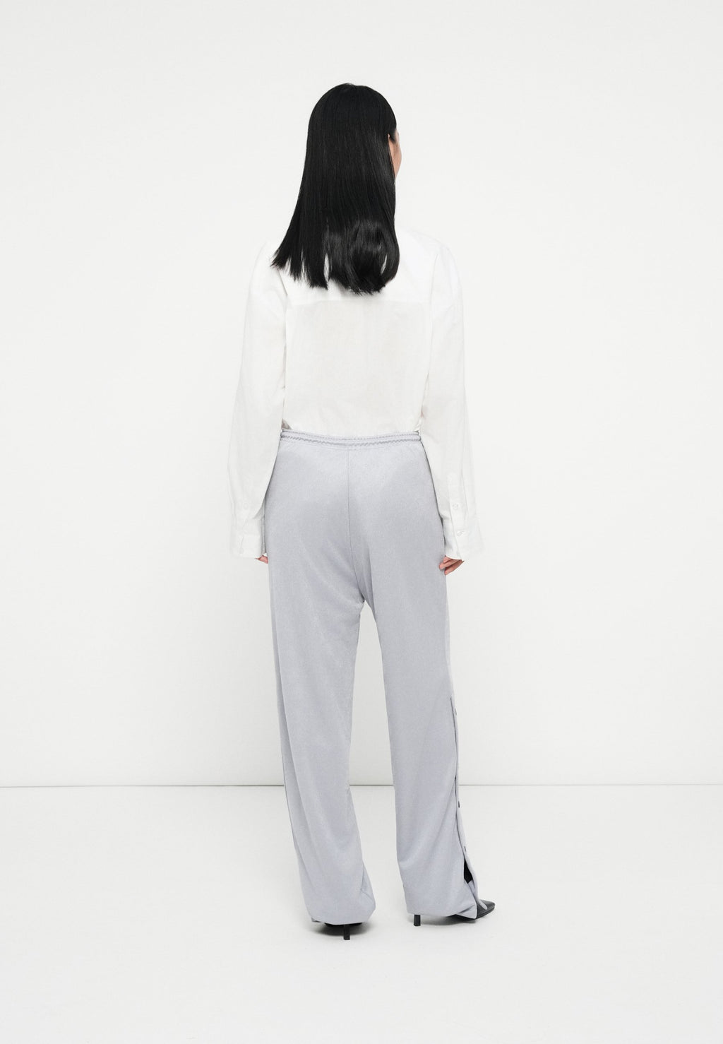 NICOLE - Tracksuit bottoms - silver-coloured