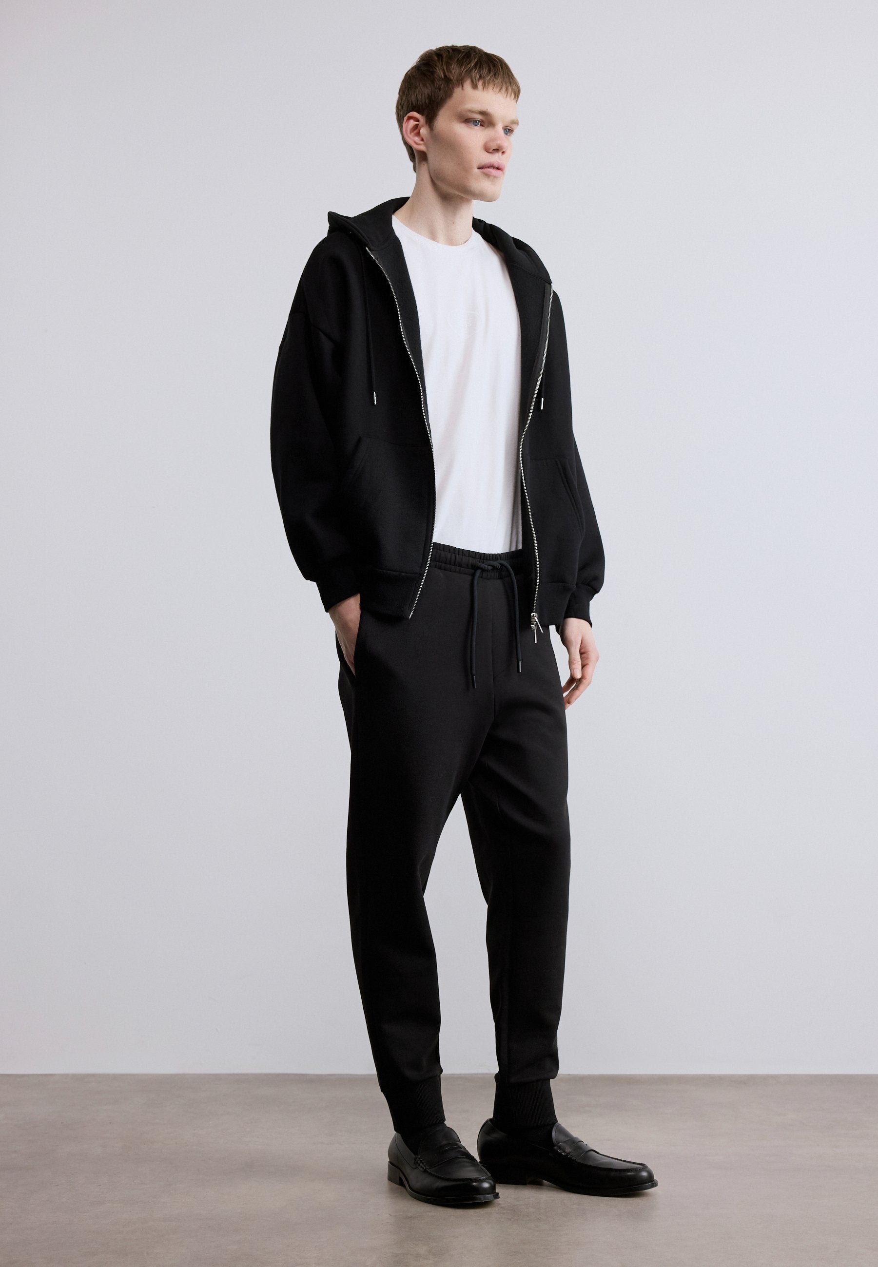HADIKO - Tracksuit bottoms - black