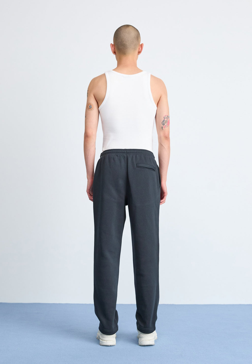 CLUB - Tracksuit bottoms - black
