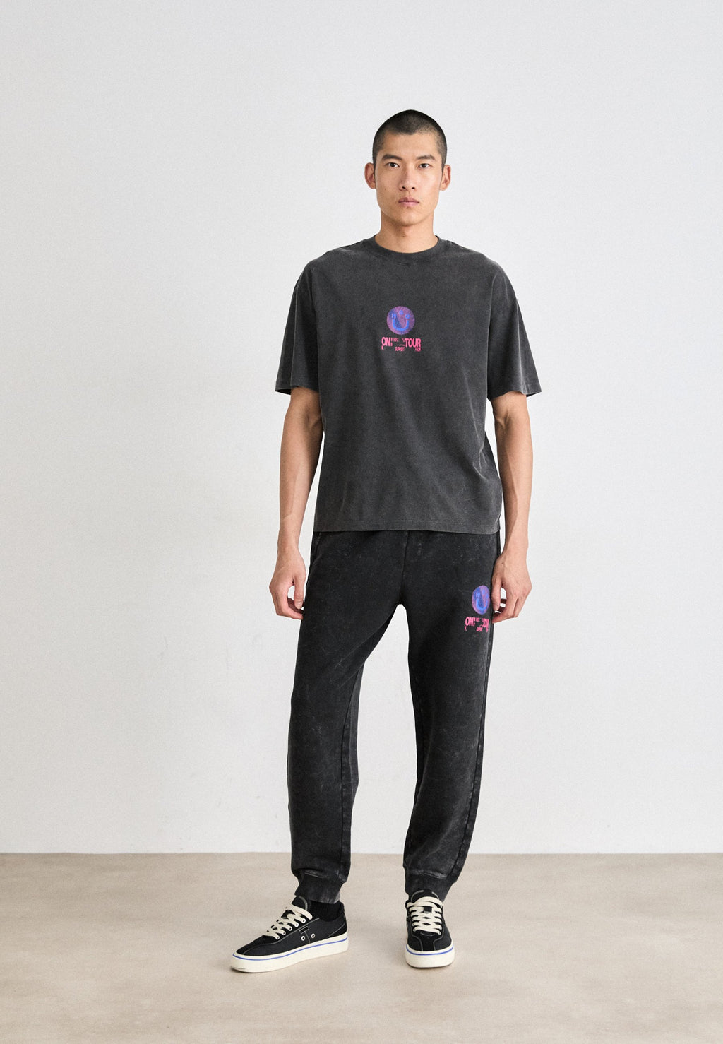 NEVEZ  - Tracksuit bottoms - black