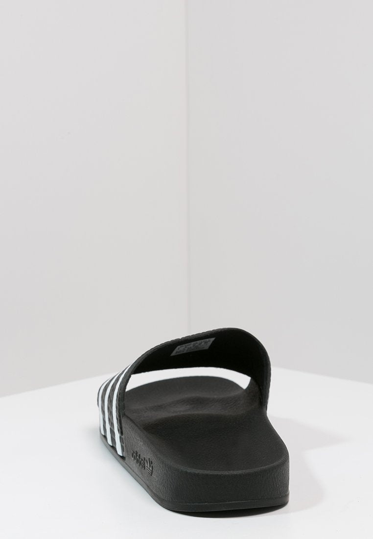ADILETTE - Pool slides - black/white