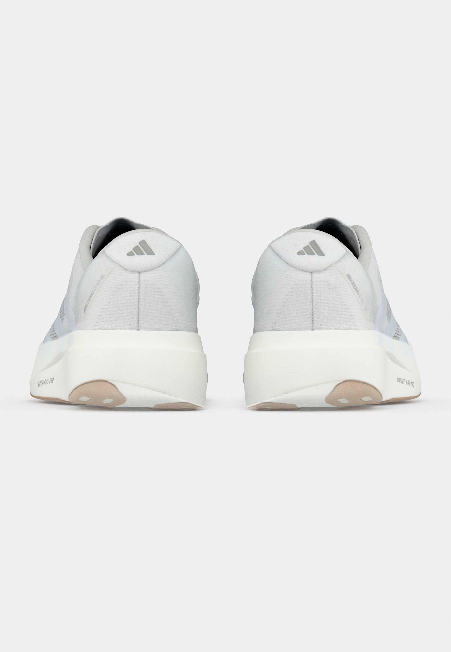 ADIZERO EVO SL M - Trainers - footwear white/warm sandstone