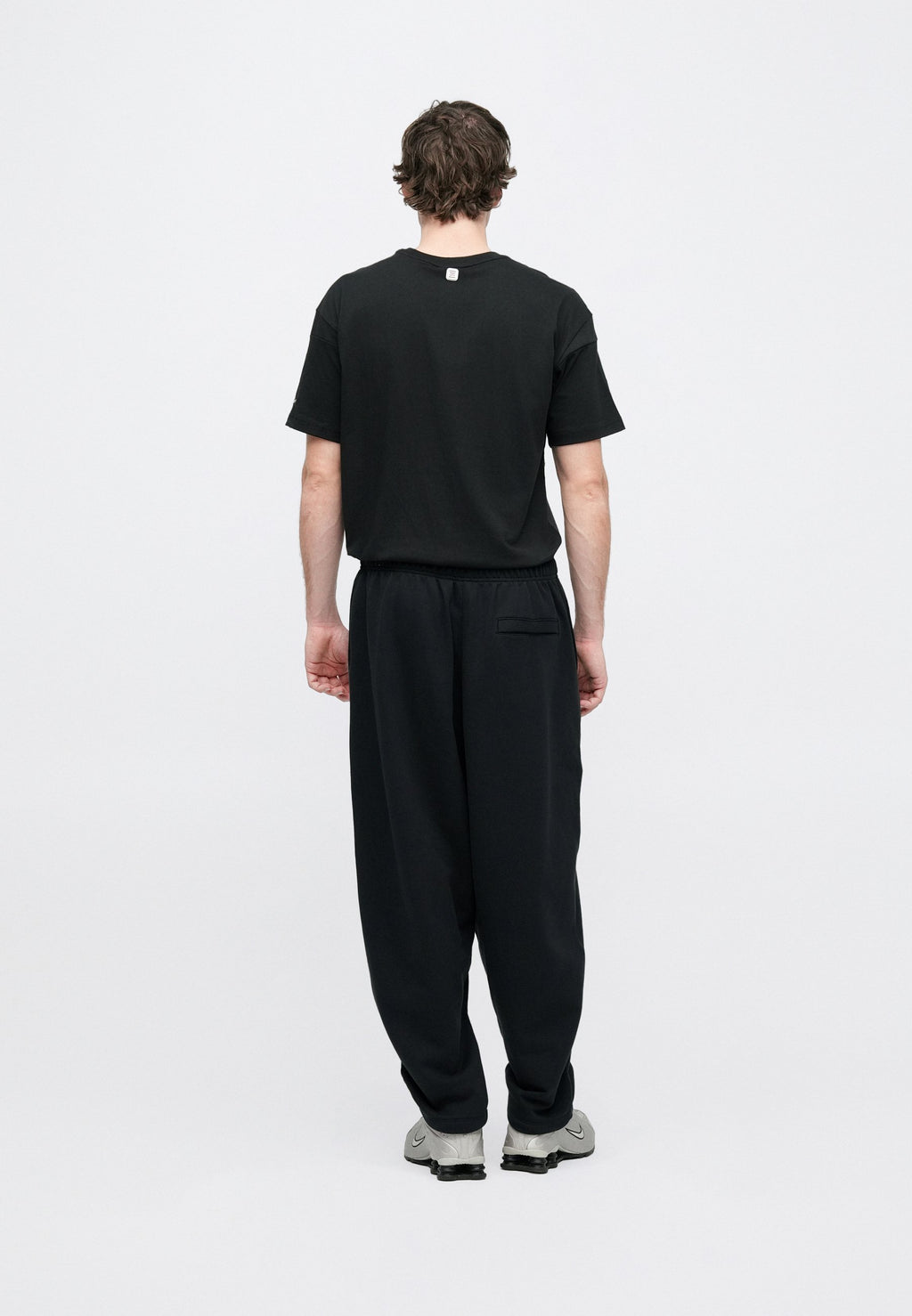 CLUB - Tracksuit bottoms - black/white