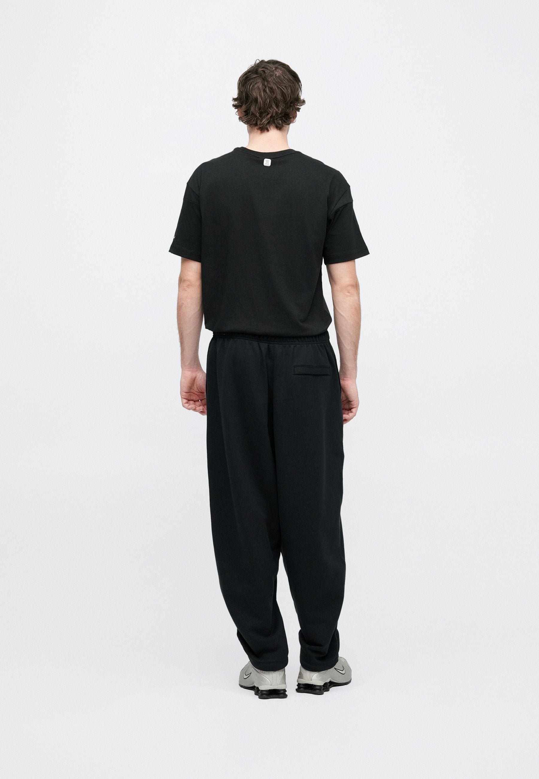 CLUB - Tracksuit bottoms - black/white