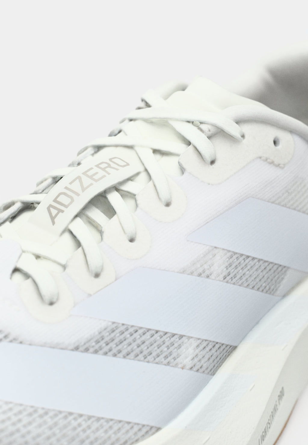 ADIZERO EVO SL M - Trainers - footwear white/warm sandstone