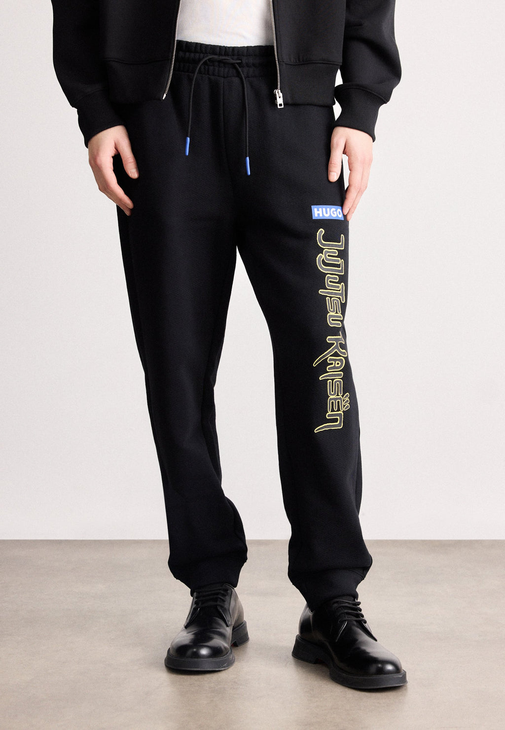 X JUJUTSU KAISEN NIMAYTRO - Tracksuit bottoms - black