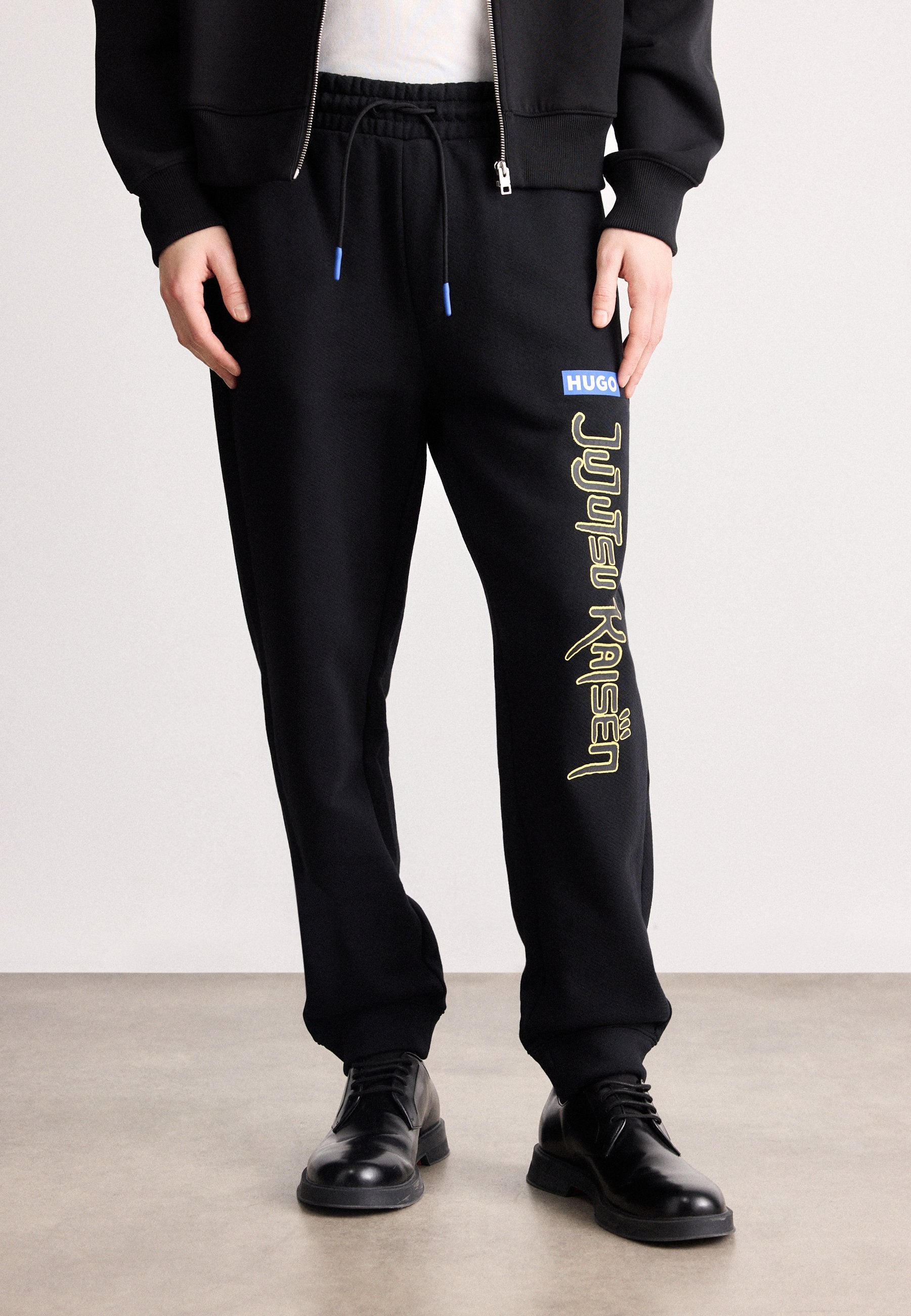 X JUJUTSU KAISEN NIMAYTRO - Tracksuit bottoms - black