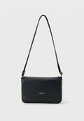 RAISED SMALL FLAP MESSENGER - Cross body bag - black