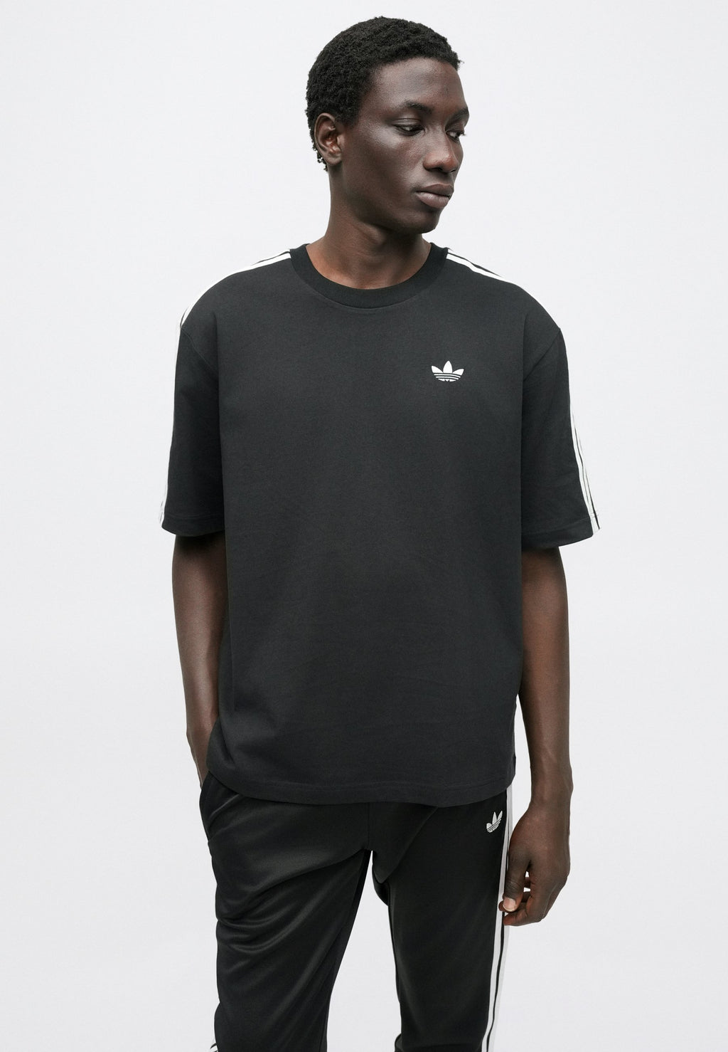 SST TP - Tracksuit bottoms - black