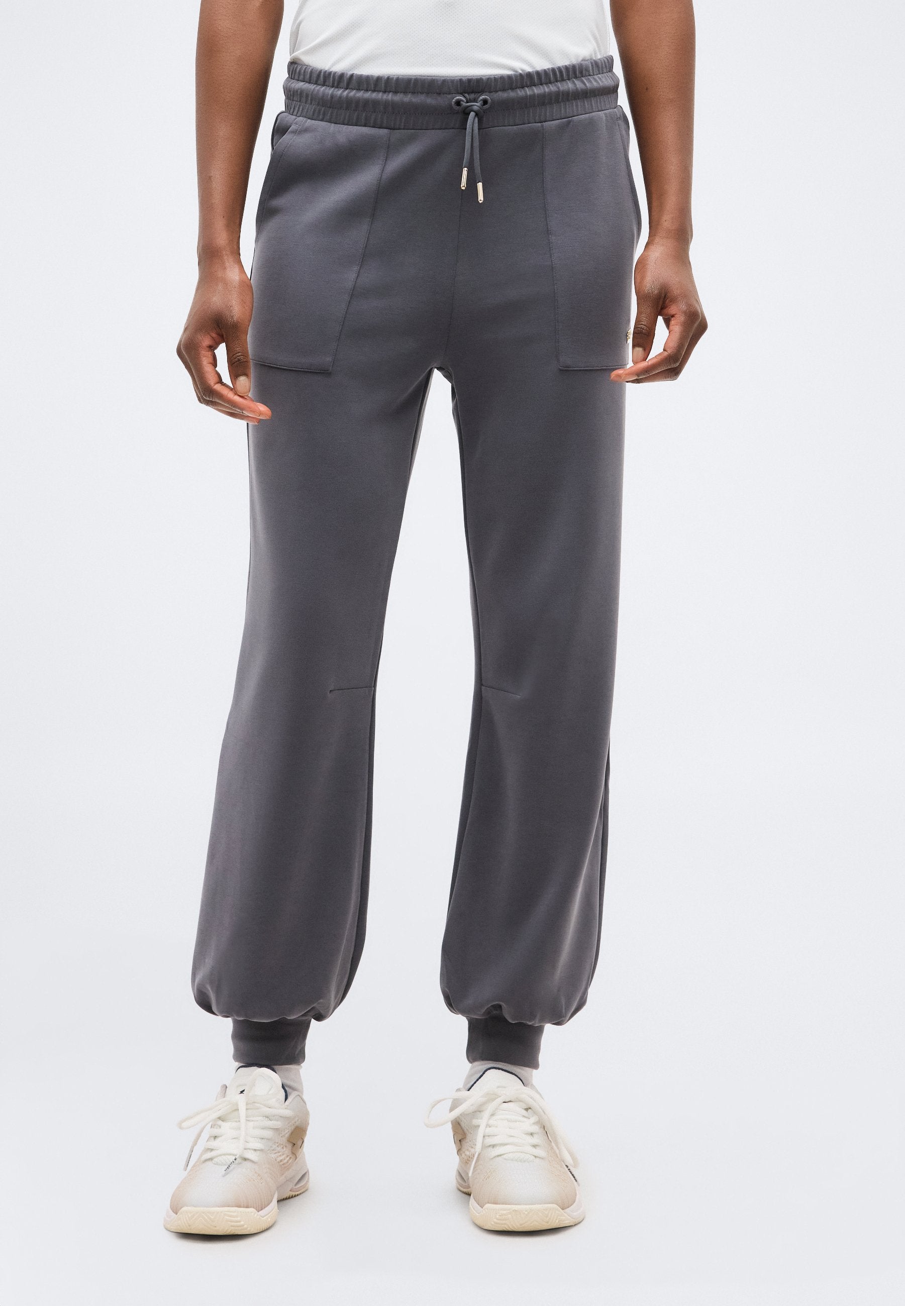 TRAIN CORE LADY RELAX - Tracksuit bottoms - gray
