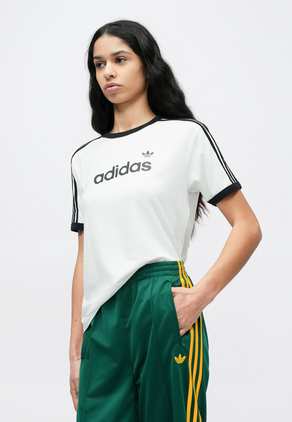FIREBIRD LOOSE TRACKSUIT PANTS - Tracksuit bottoms - collegiate green/crew yellow