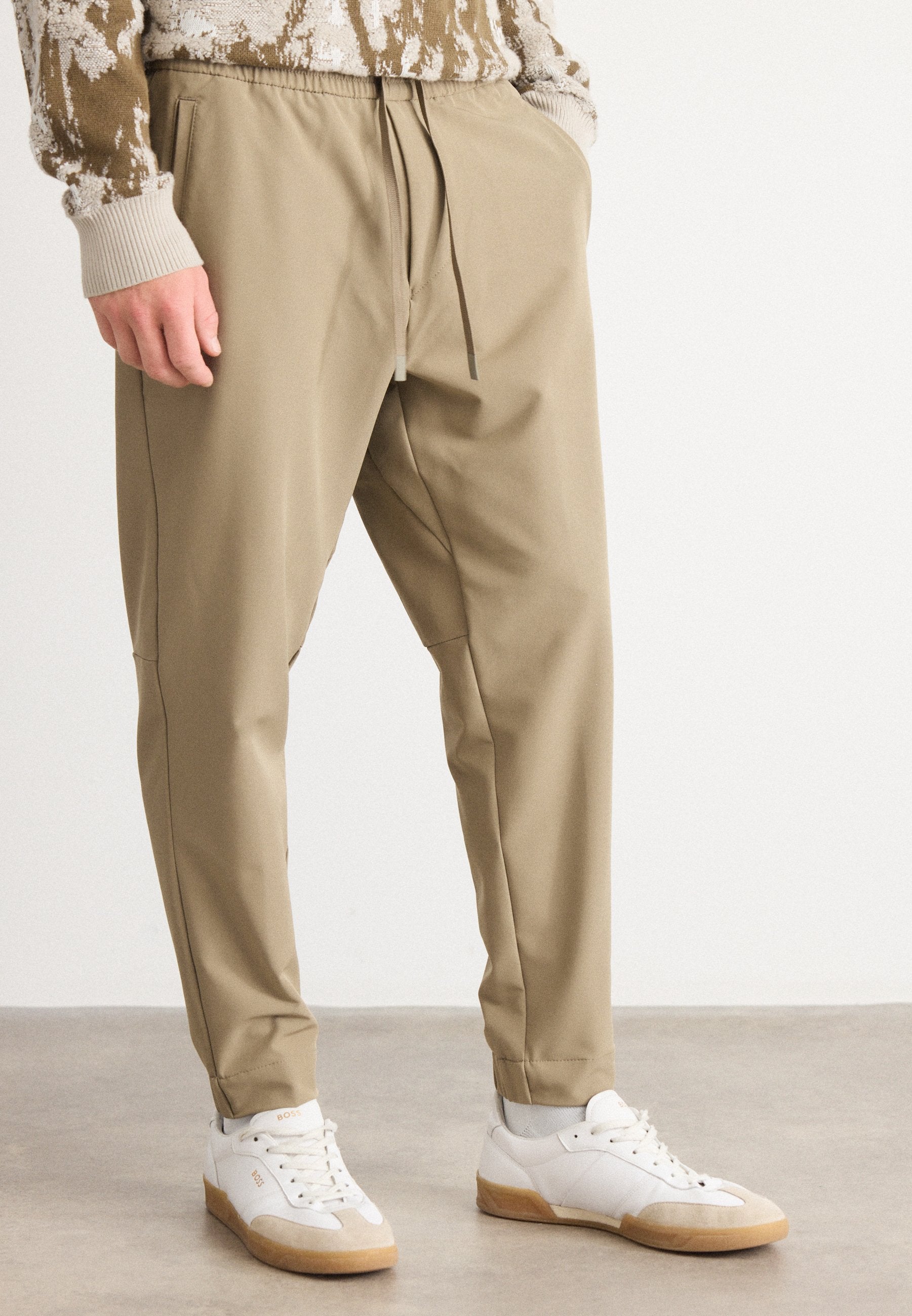 T_FLEX - Trousers - light/pastel green