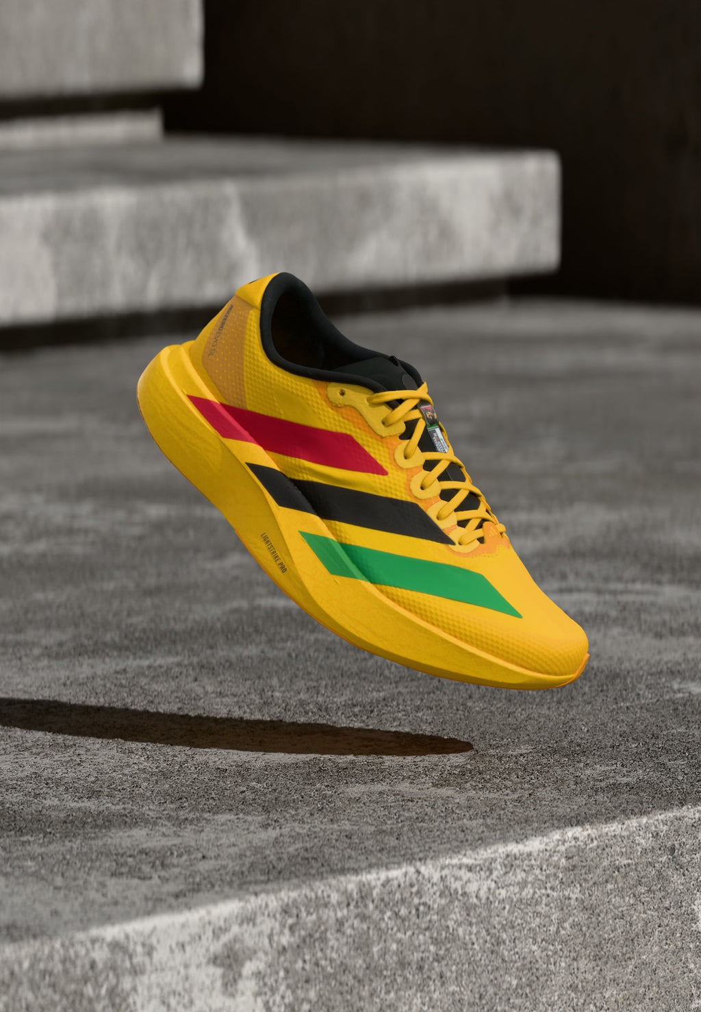 ADIZERO EVO SL - Trainers - bold gold-coloured/vivid green/pure ruby